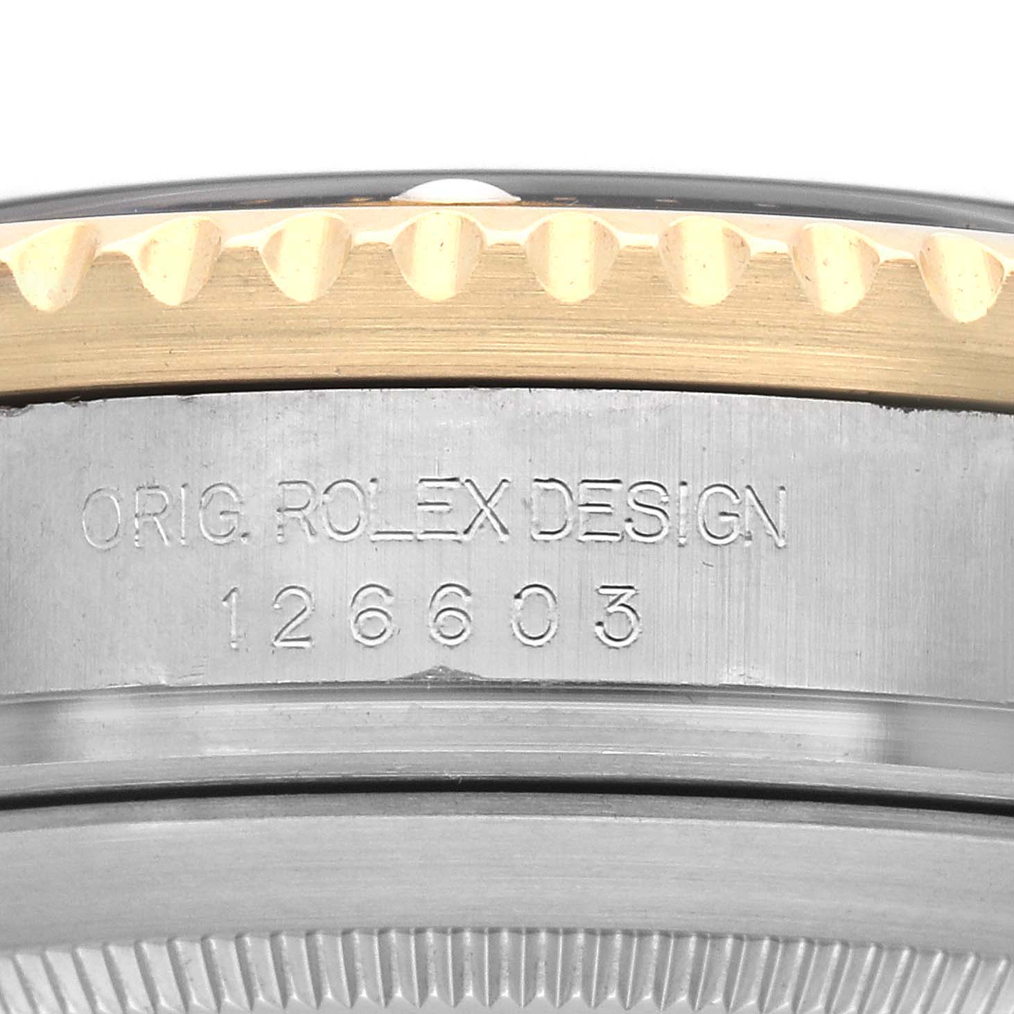 The image shows a close-up side view of the Rolex Sea-Dweller 126603 Men's Steel and Gold (two tone) Black Dial's bezel and engraved serial number.