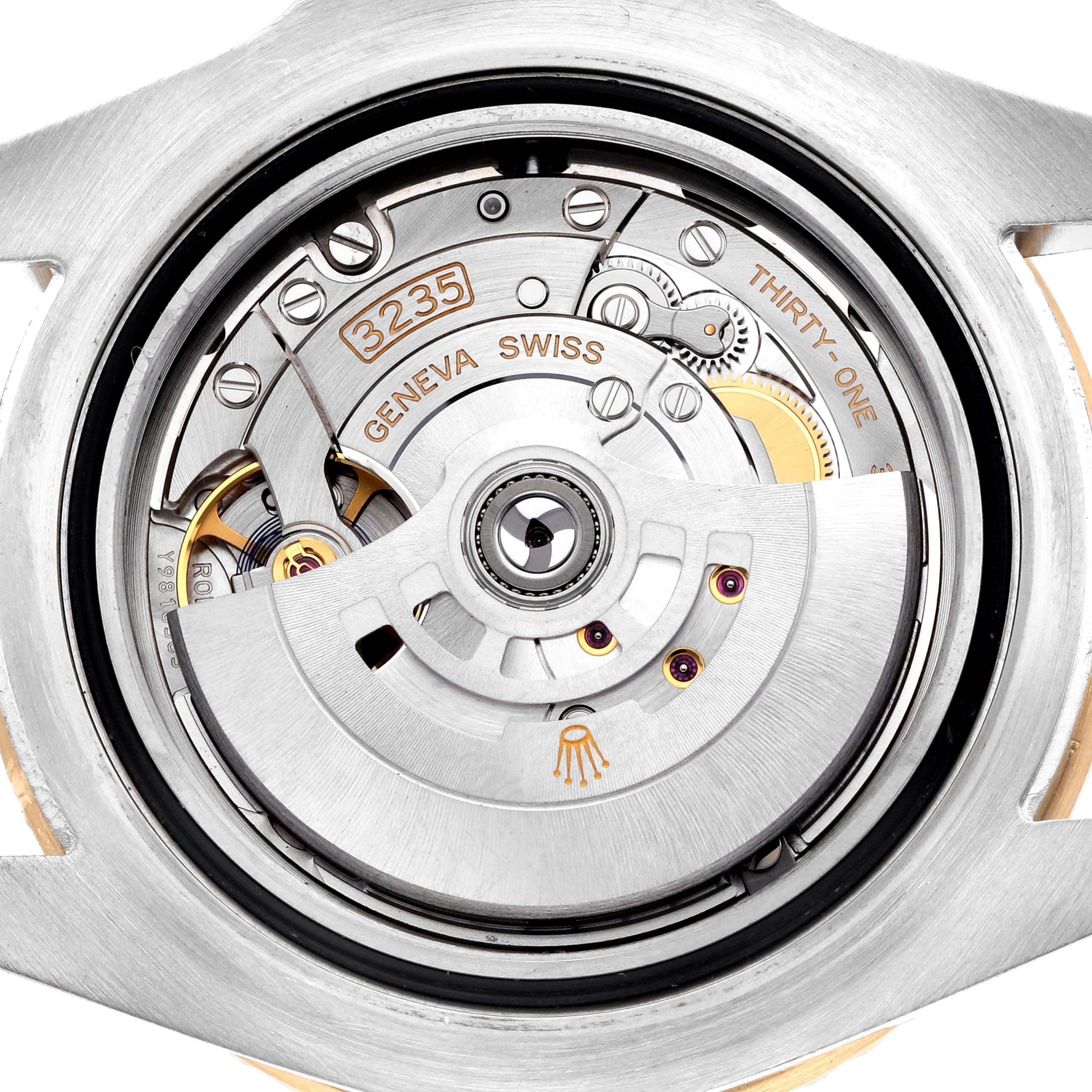 The image shows a close-up view of the movement inside a Rolex Sea-Dweller 126603 Men's Steel and Gold (two tone) Black Dial, featuring the intricate mechanics and rotor.