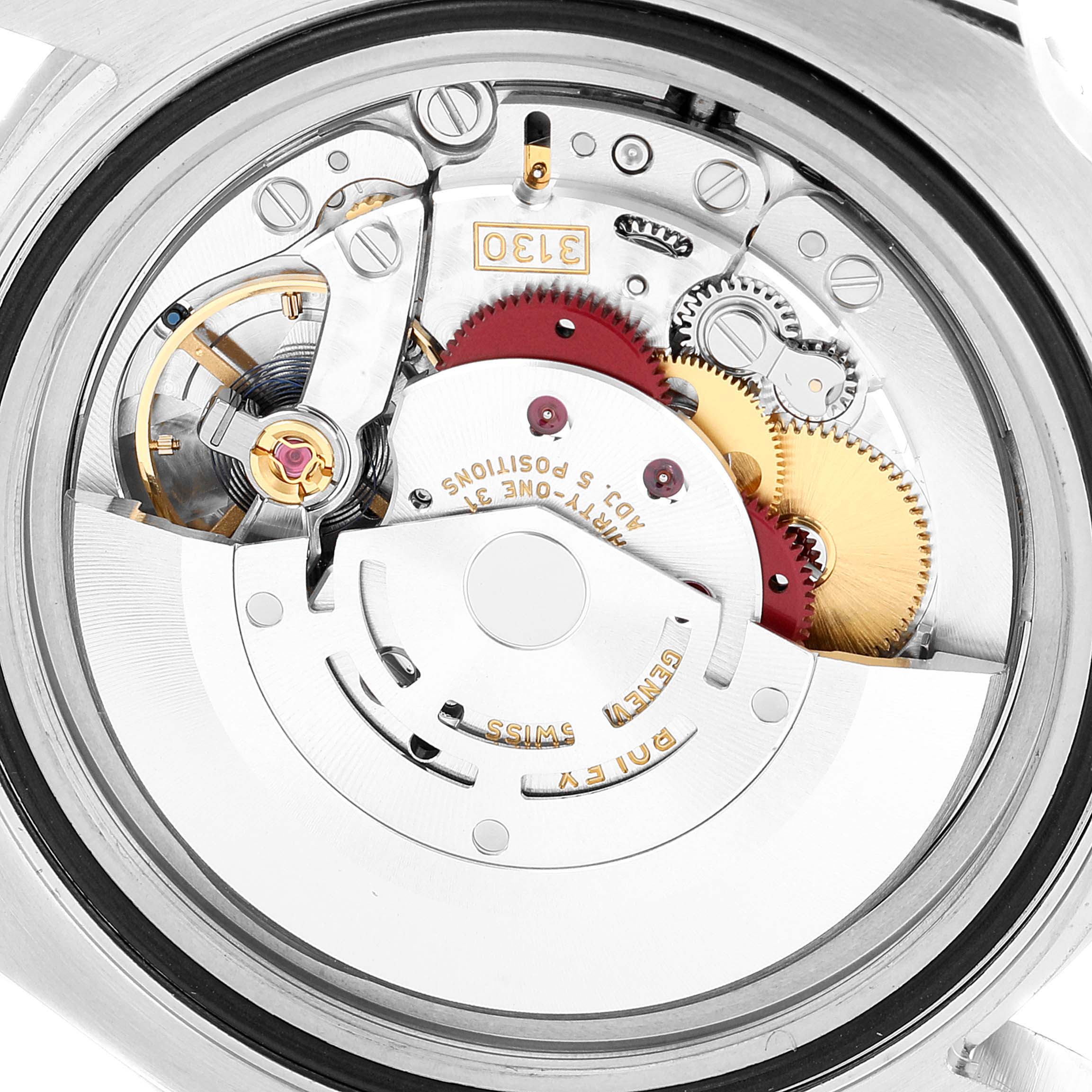 This is an inside view of the Submariner Rolex watch showing its movement and intricate internal mechanisms.