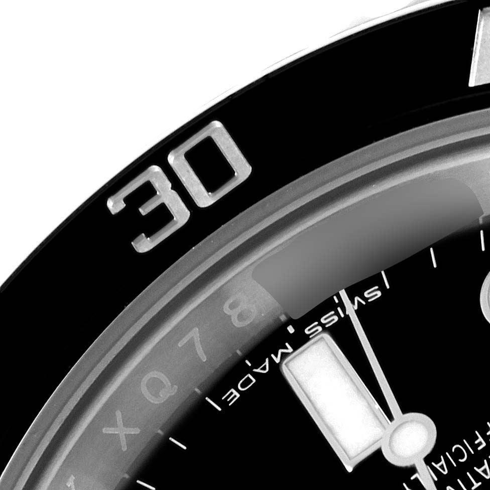 This image shows a close-up angle of the bezel and part of the dial of a Rolex Submariner 114060 Men
s Stainless Steel Black Dial 114060 Men
s Stainless Steel Black Dial watch.