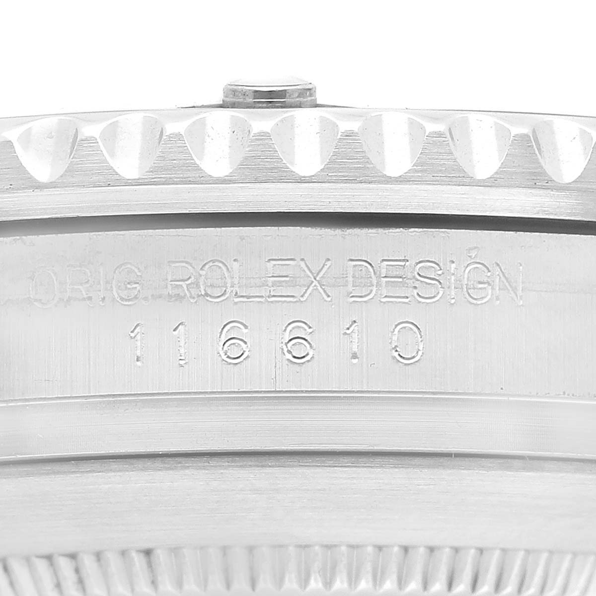 The image shows a close-up of the side of a Rolex Submariner 116610LV Men's Stainless Steel Green Dial 116610LV Men's Stainless Steel Green Dial watch, highlighting the model number 116610 and the engraved text "ORIG. ROLEX DESIGN."