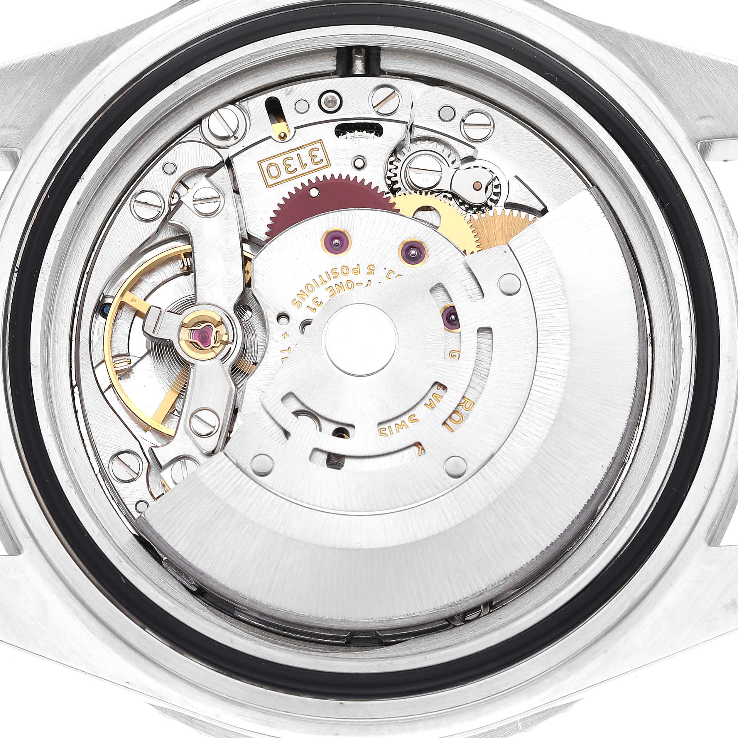 This image shows the movement mechanism of a Rolex Submariner 14060 Men
s Stainless Steel Black Dial 14060 Men
s Stainless Steel Black Dial watch from the back.