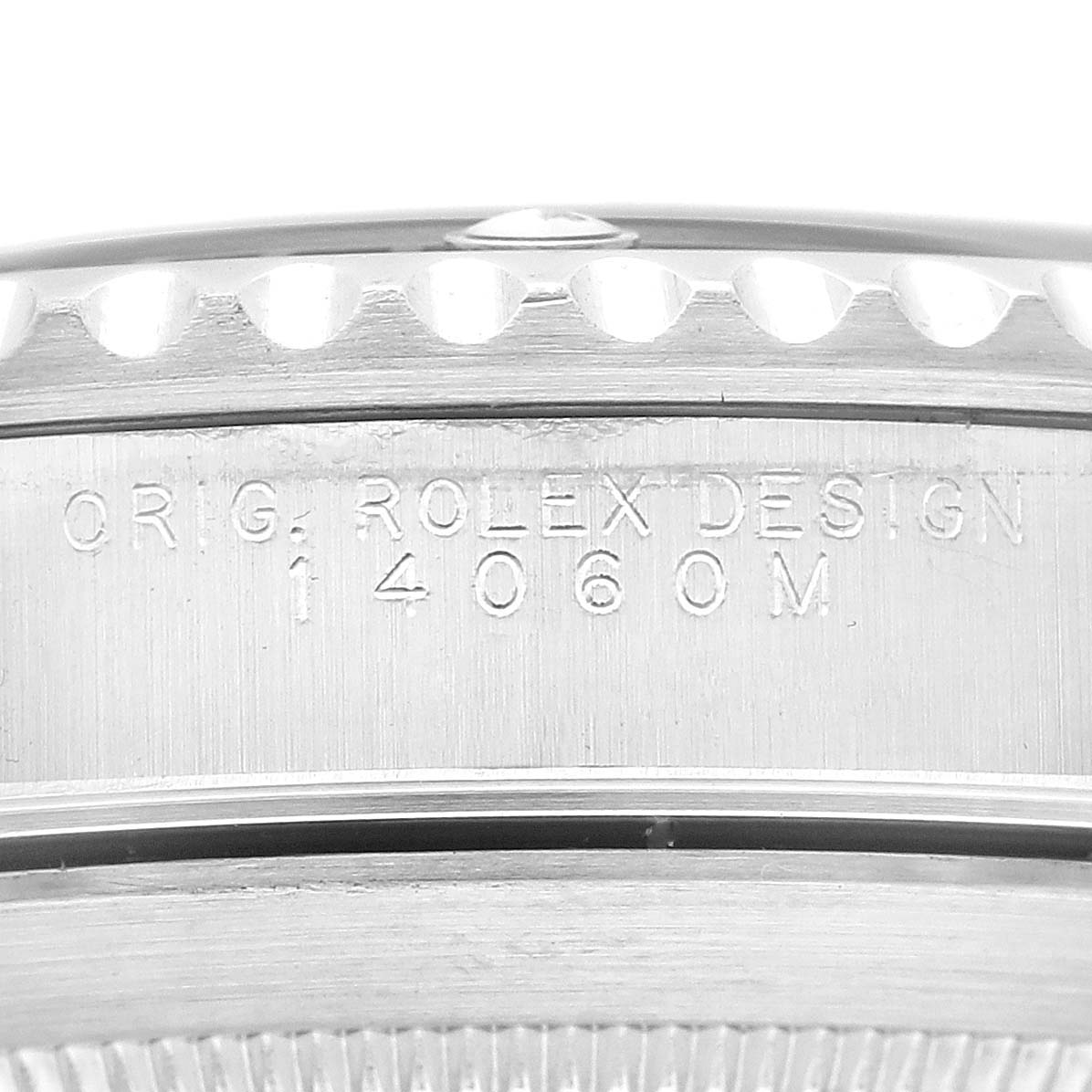This image shows a close-up of the case back and side engraving on a Rolex Submariner 14060 Men
s Stainless Steel Black Dial 14060 Men
s Stainless Steel Black Dial watch.