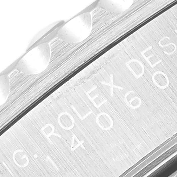 The image shows a close-up of the Rolex Submariner 14060 Men
s Stainless Steel Black Dial 14060 Men
s Stainless Steel Black Dial
s bezel and engraved side.