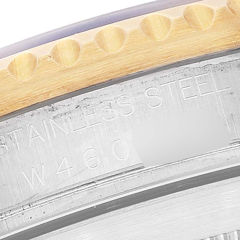 The image shows a close-up of the case back edge and partially visible bezel of a Rolex Submariner 16613 Men
s Steel and Gold (two tone) Grey Dial 16613 Men
s Steel and Gold (two tone) Grey Dial watch.