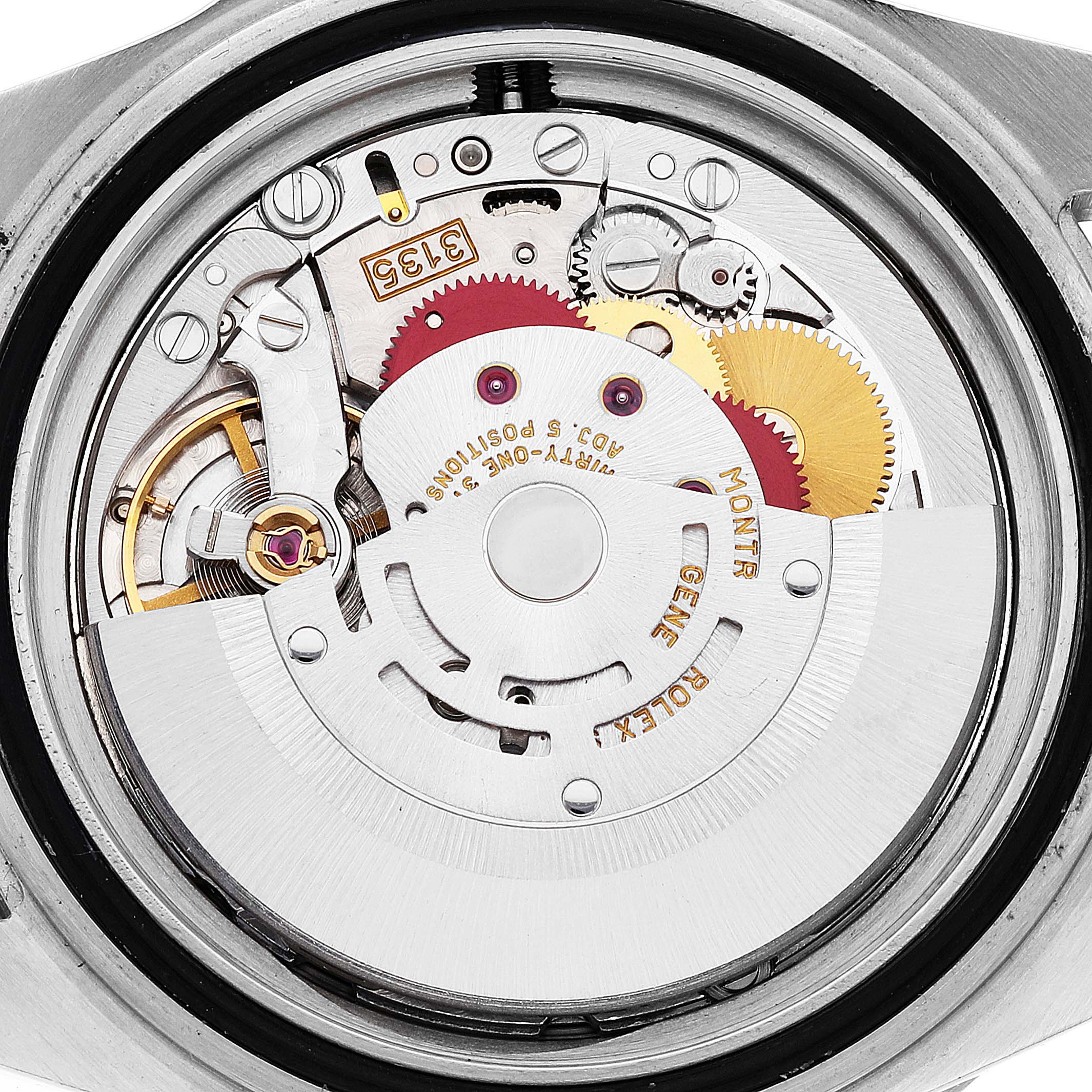 This image shows the internal mechanics of the Rolex Submariner 16613 Men
s Steel and Gold (two tone) Grey Dial 16613 Men
s Steel and Gold (two tone) Grey Dial watch, focusing on the movement and gearing.
