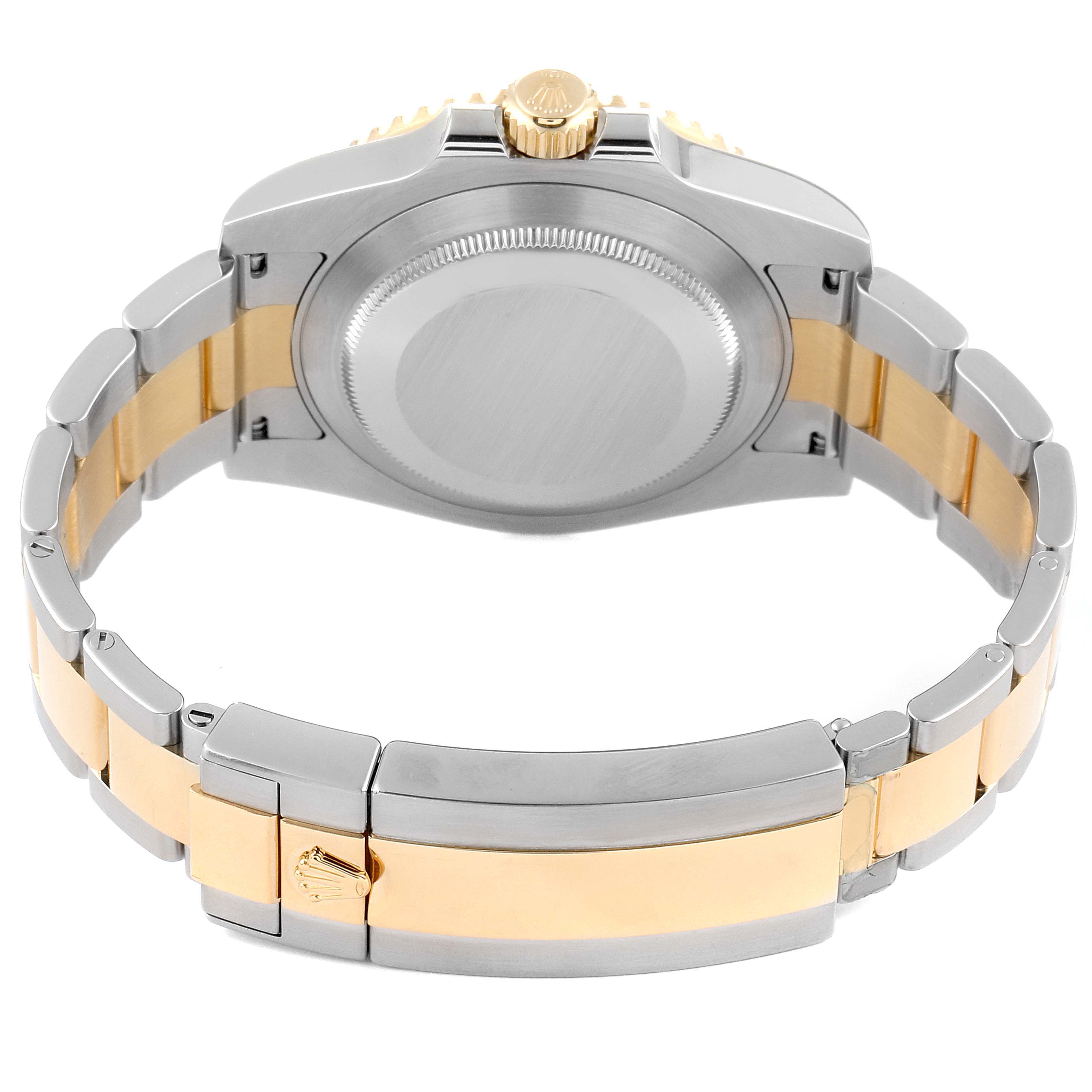 This image shows the back case and the clasp of a Rolex Submariner 116613 Men's Steel and Gold (two tone) Black Dial 116613 Men's Steel and Gold (two tone) Black Dial watch, highlighting its two-tone metal bracelet.