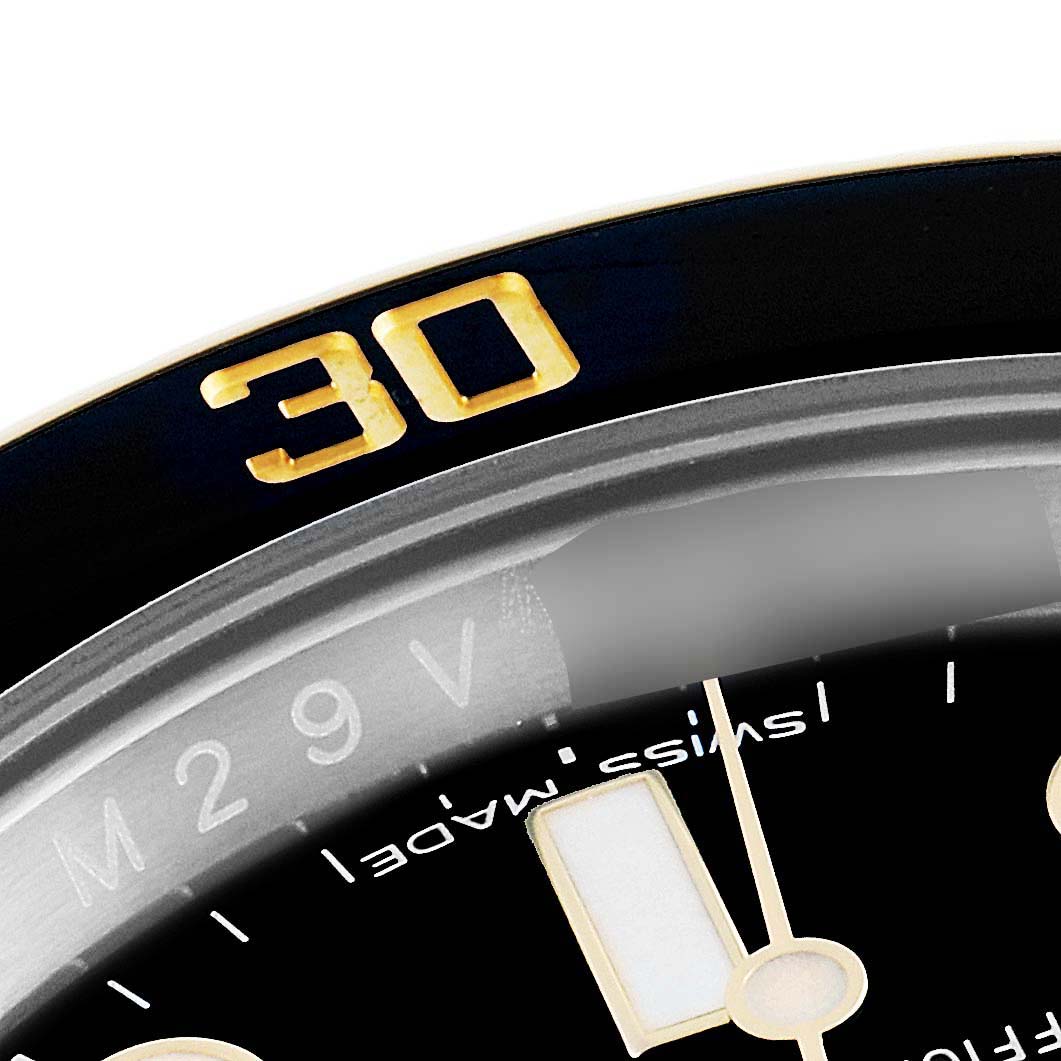 The image shows a close-up angle of the bezel and dial of a Rolex Submariner 116613 Men's Steel and Gold (two tone) Black Dial 116613 Men's Steel and Gold (two tone) Black Dial watch, highlighting the 30-minute marker.