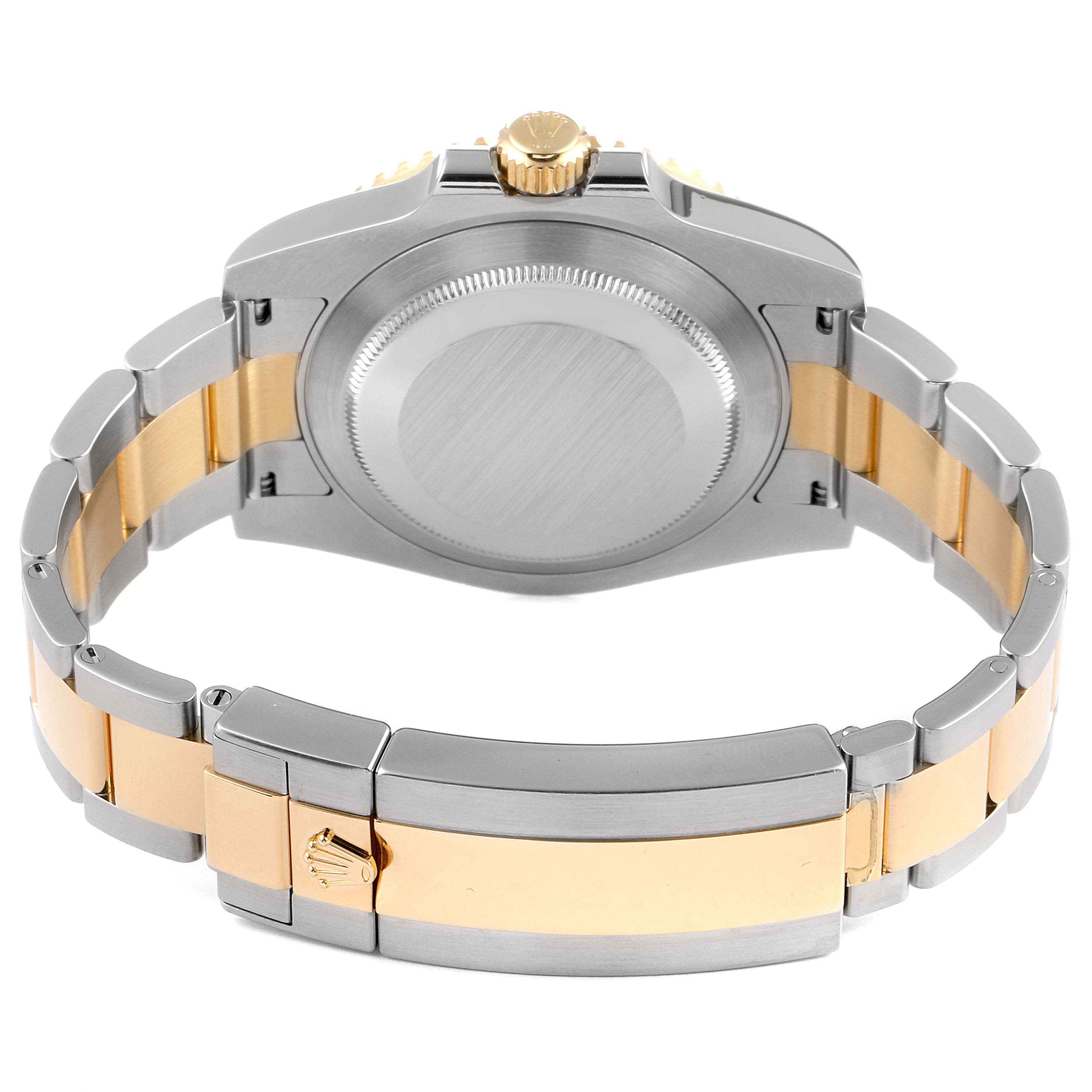 This image shows the back view of a Rolex Submariner 116613 Men's Steel and Gold (two tone) Black Dial 116613 Men's Steel and Gold (two tone) Black Dial, highlighting its two-tone bracelet and clasp.