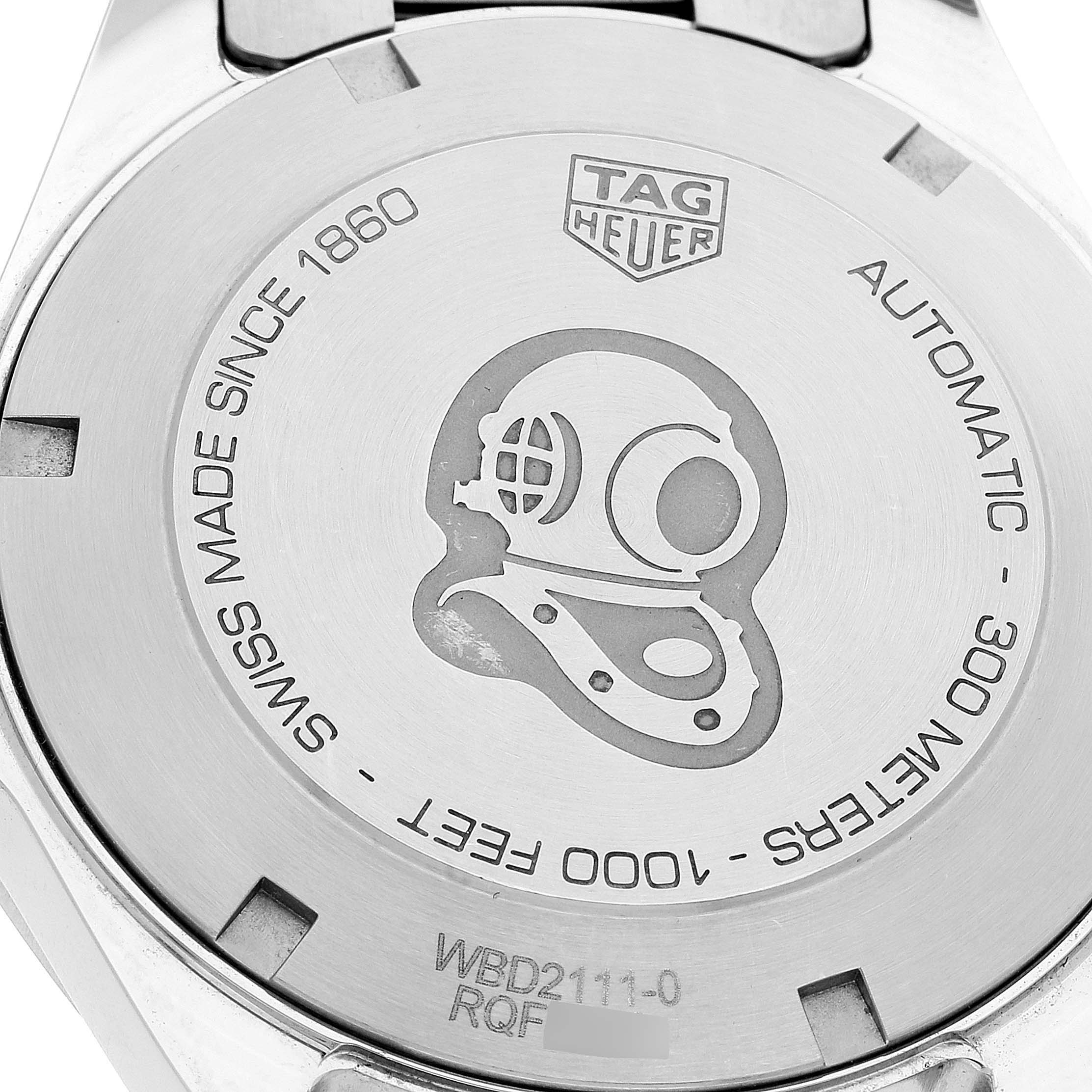 The image shows the back case of a Tag Heuer Aquaracer WBD2111.BA0928 Men's Stainless Steel White Dial WBD2111.BA0928 Men's Stainless Steel White Dial watch, emphasizing its engraved details and branding.