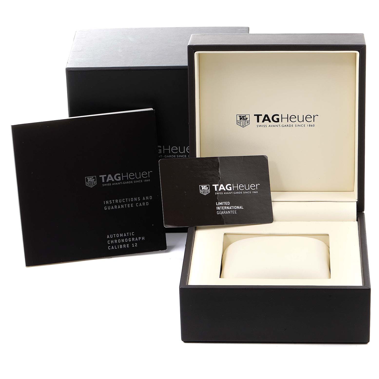 The image shows the Tag Heuer Monaco CAW2111 Men
s Stainless Steel Blue Dial CAW2111 Men
s Stainless Steel Blue Dial watch box, instruction manual, and a guarantee card.