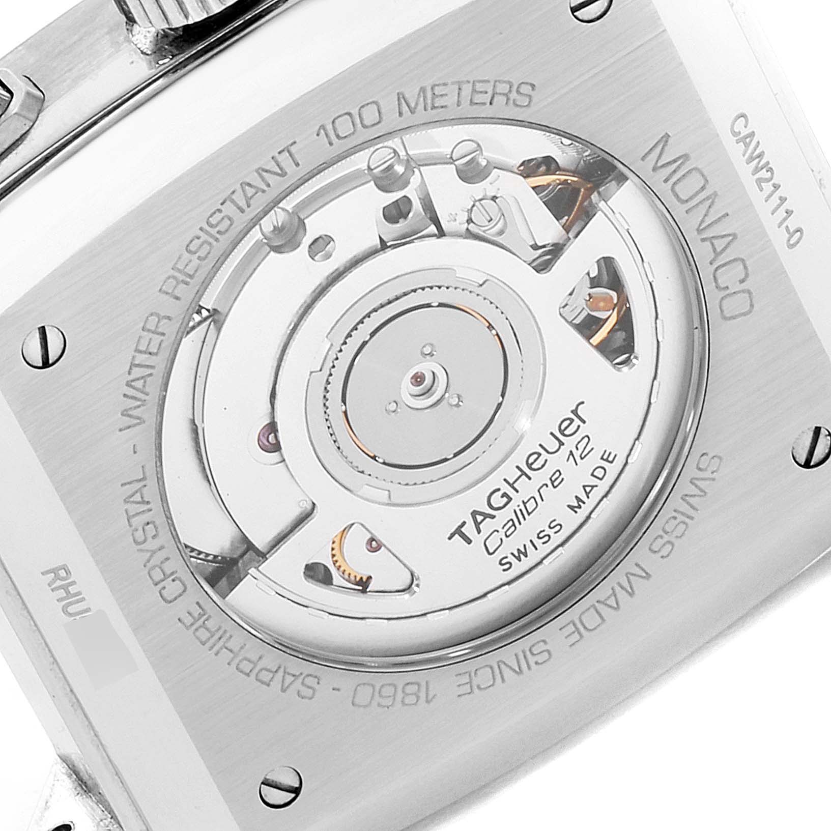 The image shows the back view of a Tag Heuer Monaco CAW2111 Men
s Stainless Steel Blue Dial CAW2111 Men
s Stainless Steel Blue Dial watch, revealing its inner mechanism and engraving details.