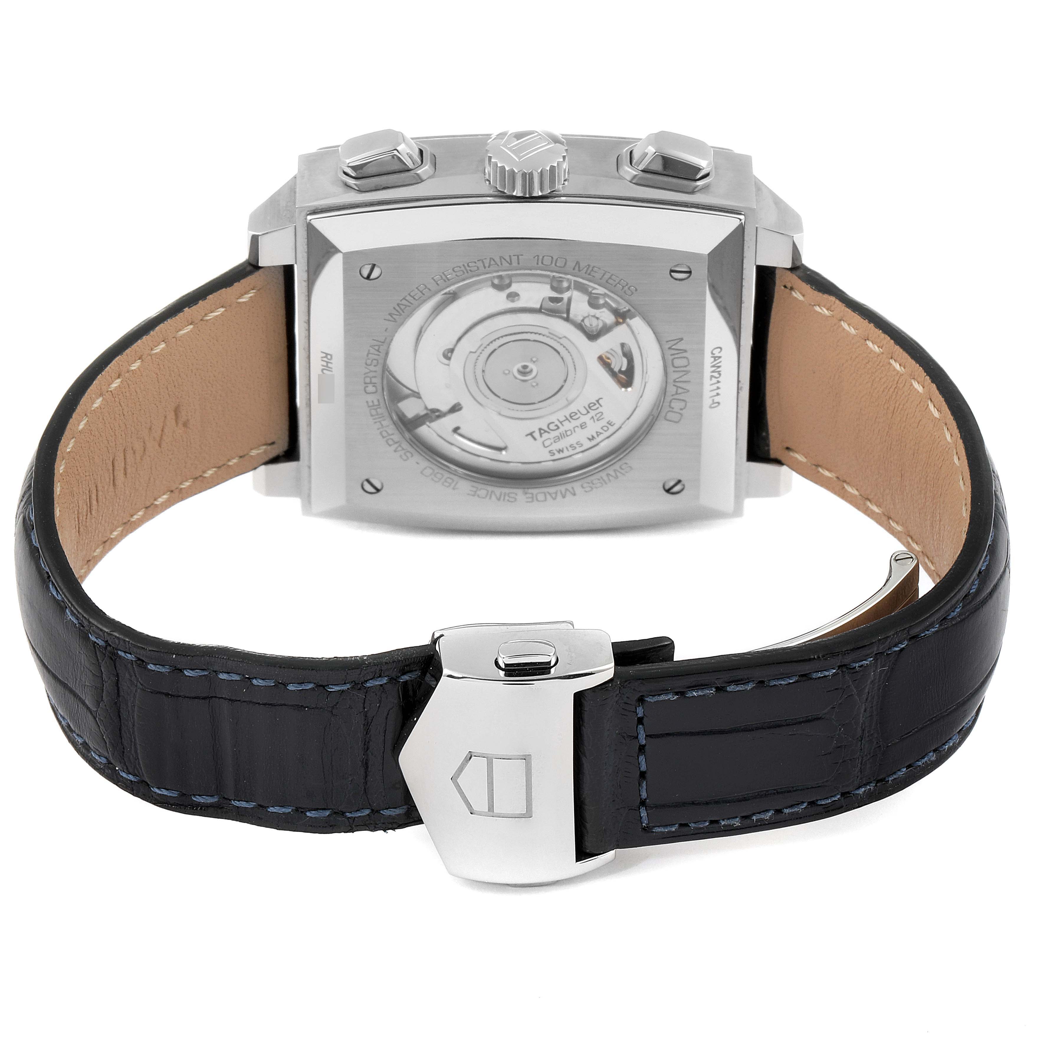 The image shows the back view of a Tag Heuer Monaco CAW2111 Men
s Stainless Steel Blue Dial CAW2111 Men
s Stainless Steel Blue Dial watch, highlighting its automatic movement and leather strap with a clasp.