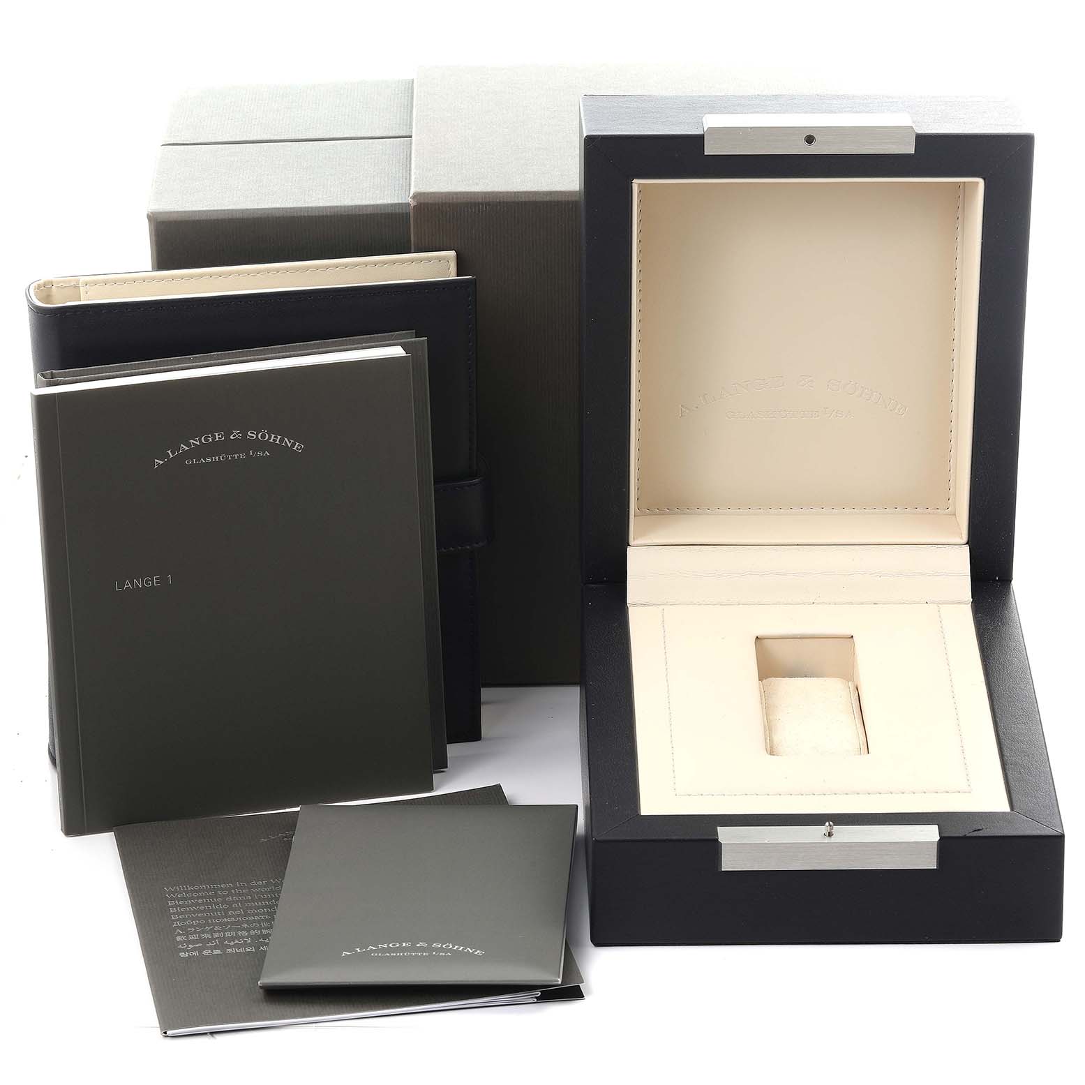 The image shows the empty box, manuals, and packaging for the Lange 1 watch by A. Lange 
Söhne.