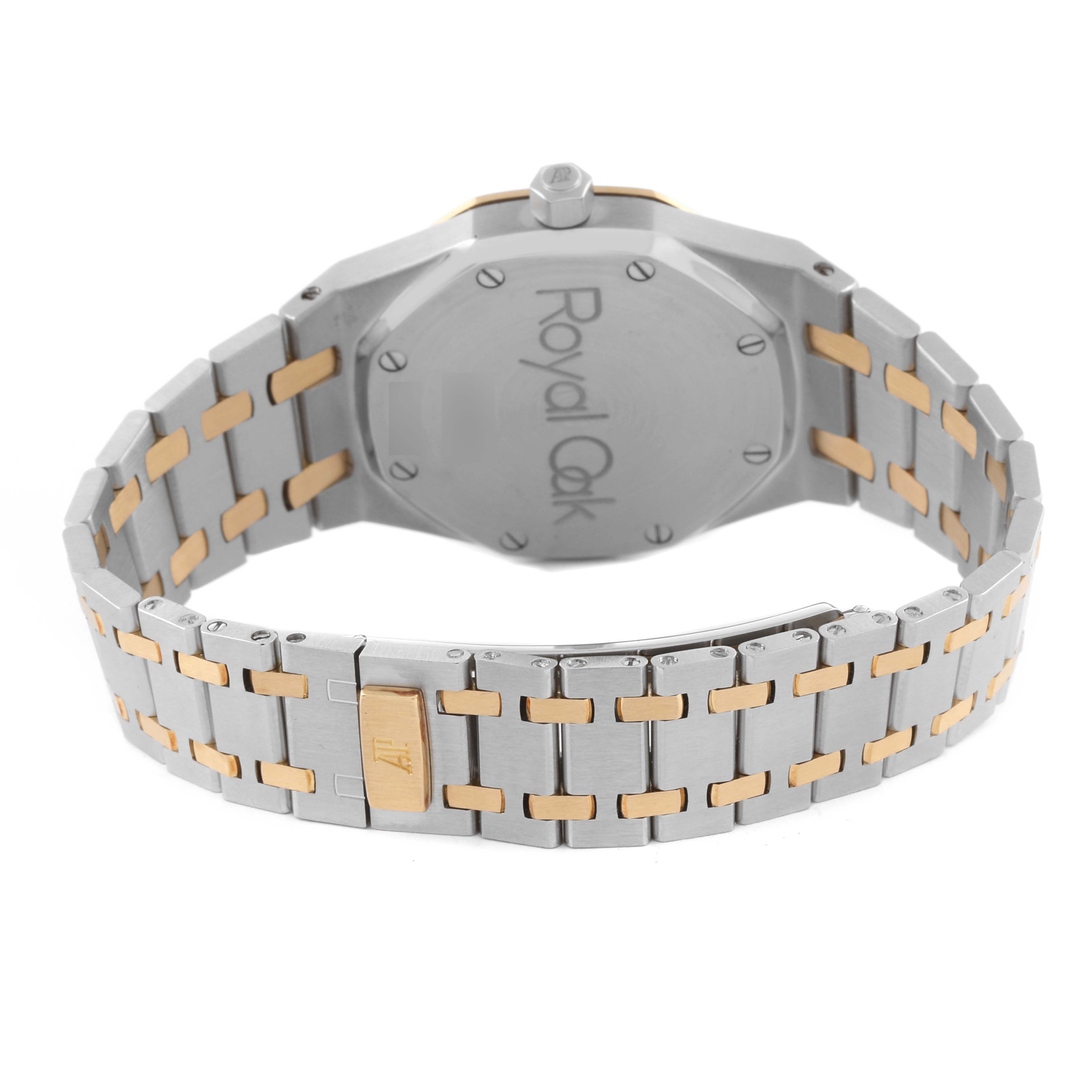 The image shows the back of a Royal Oak by Audemars Piguet, highlighting the bracelet and engraved caseback.