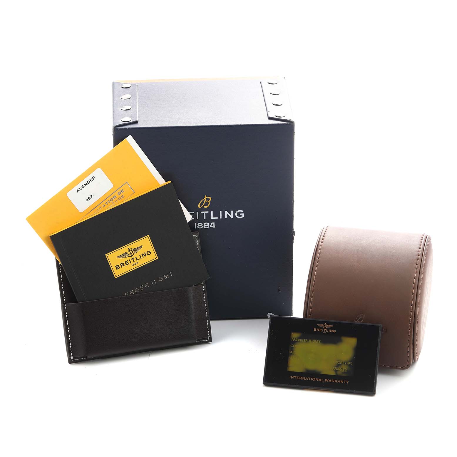The image shows the packaging and accessories for a Breitling Avenger A3239011/A809 Men's Stainless Steel Mother of Pearl Dial, including a box, manual, leather case, and warranty card.