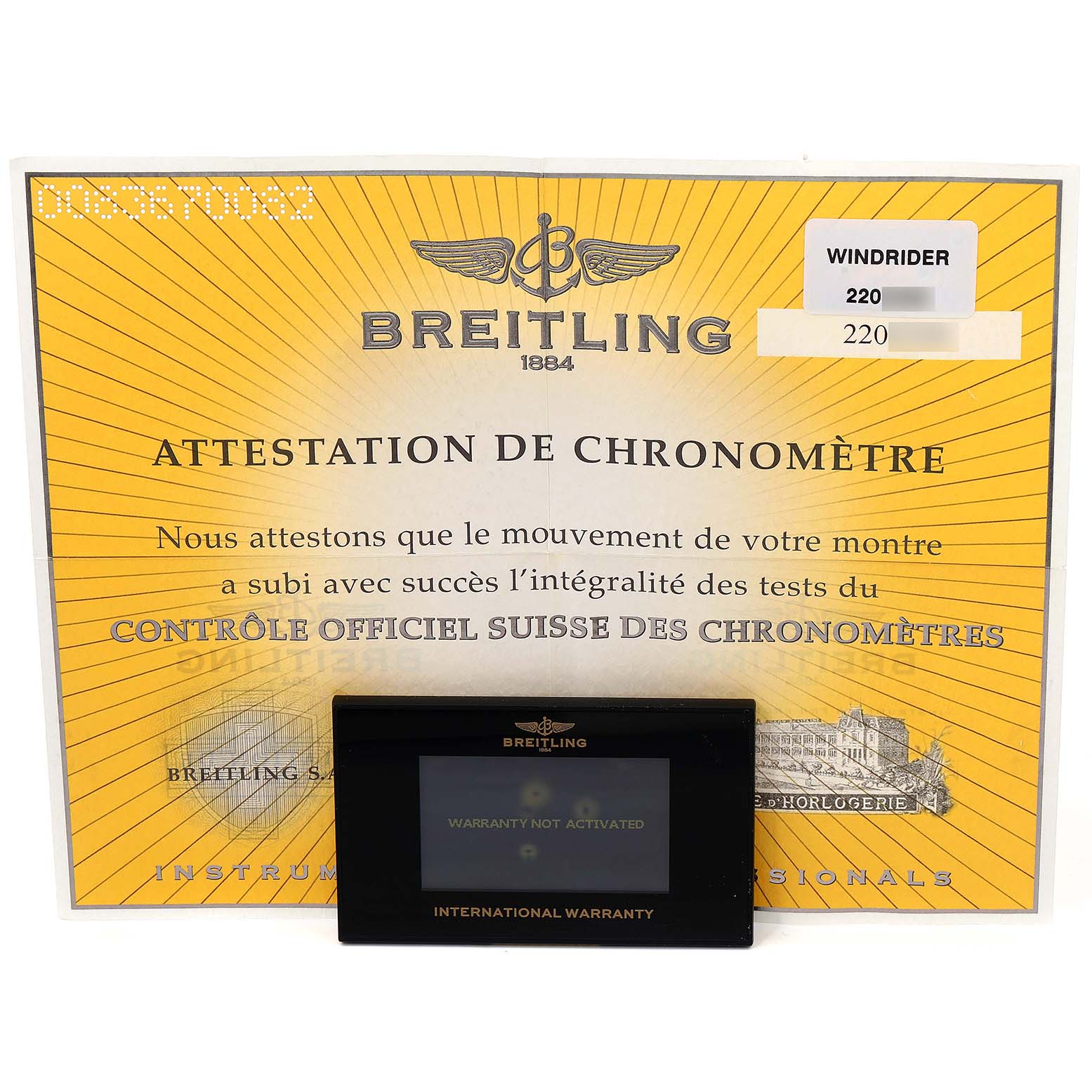 This image shows the certificate and warranty card for a Breitling Chronomat K13358 Men's Yellow Gold Mother of Pearl Dial K13358 Men's Yellow Gold Mother of Pearl Dial watch.