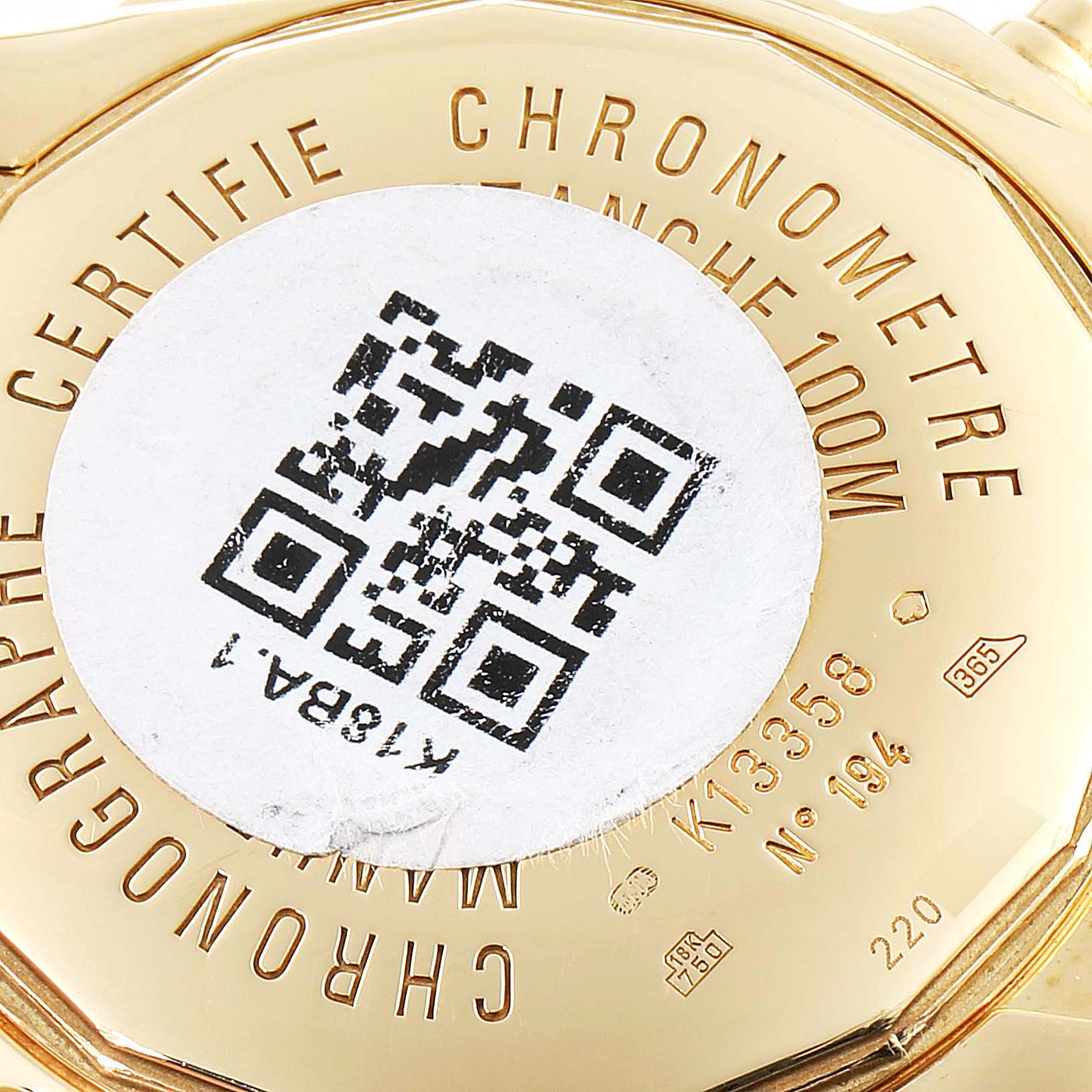 The image shows the back of a Breitling Chronomat K13358 Men's Yellow Gold Mother of Pearl Dial K13358 Men's Yellow Gold Mother of Pearl Dial watch, featuring a QR code and engraved details.