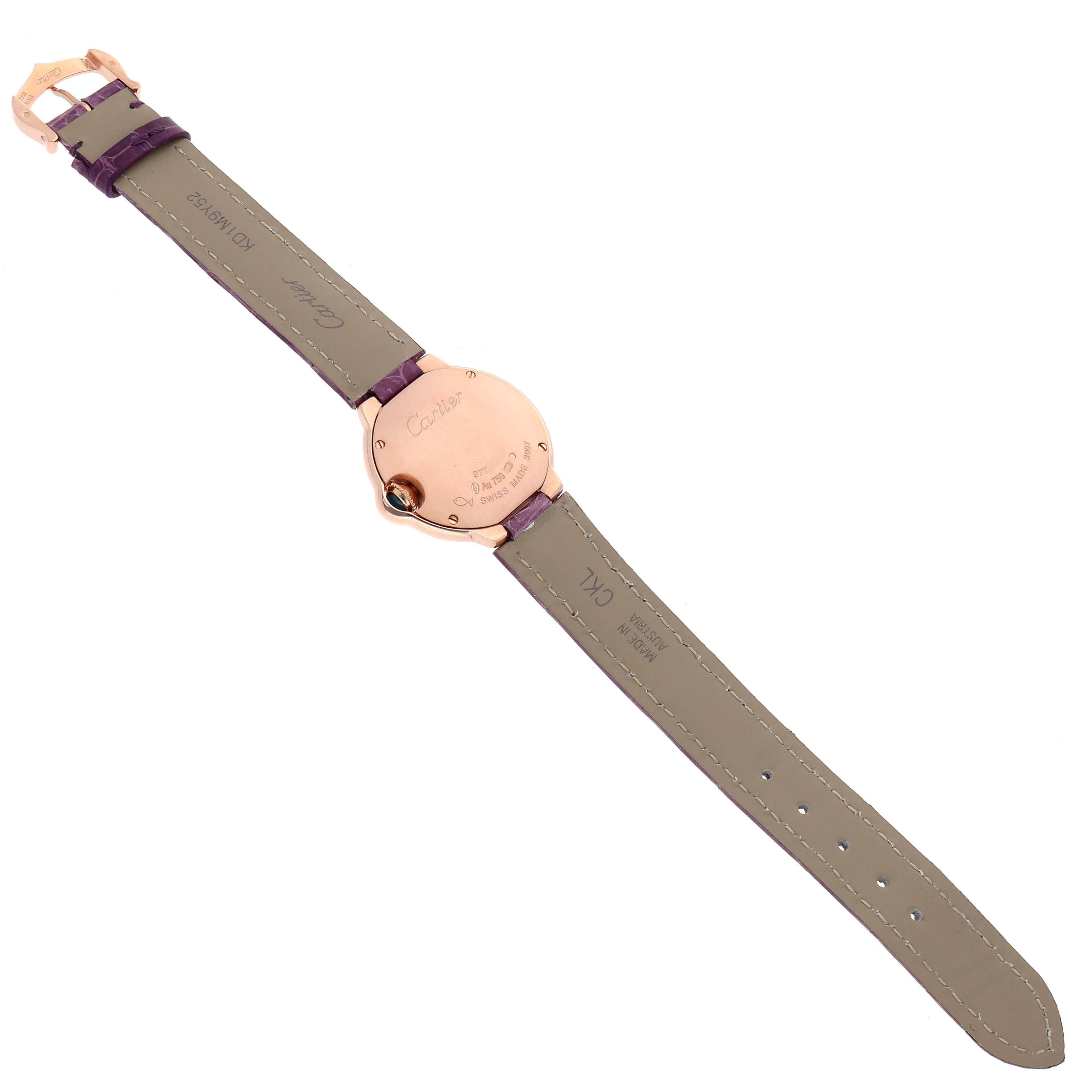 The Cartier Ballon Bleu W6900256 Women's Rose Gold Silver Dial watch is shown from the back, displaying the case back and leather strap with its buckle.