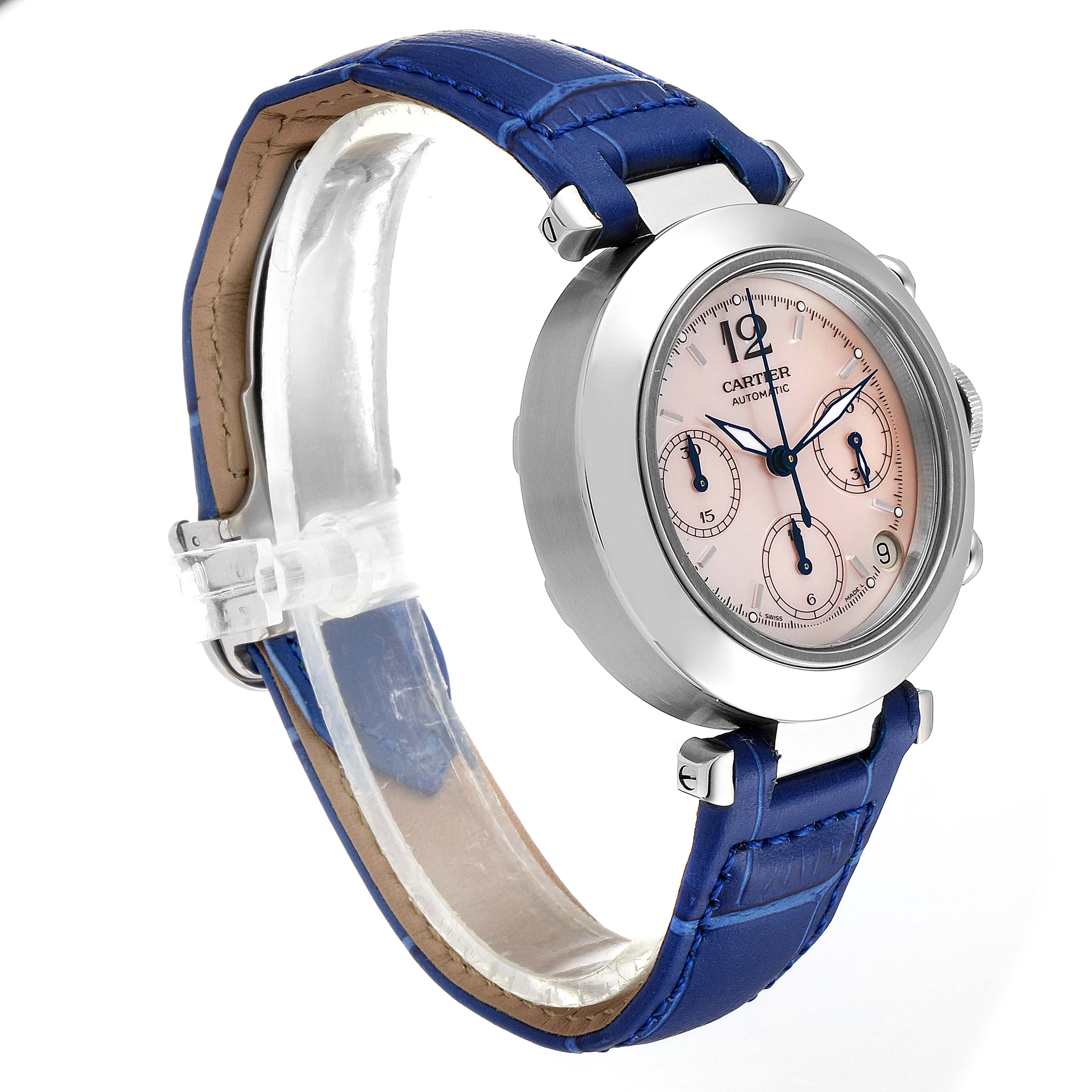 The image shows a Cartier Pasha W3106599 Women's Stainless Steel Mother of Pearl Dial W3106599 Women's Stainless Steel Mother of Pearl Dial watch at a 3/4 angle, highlighting its blue strap, silver casing, and pink dial with three subdials.
