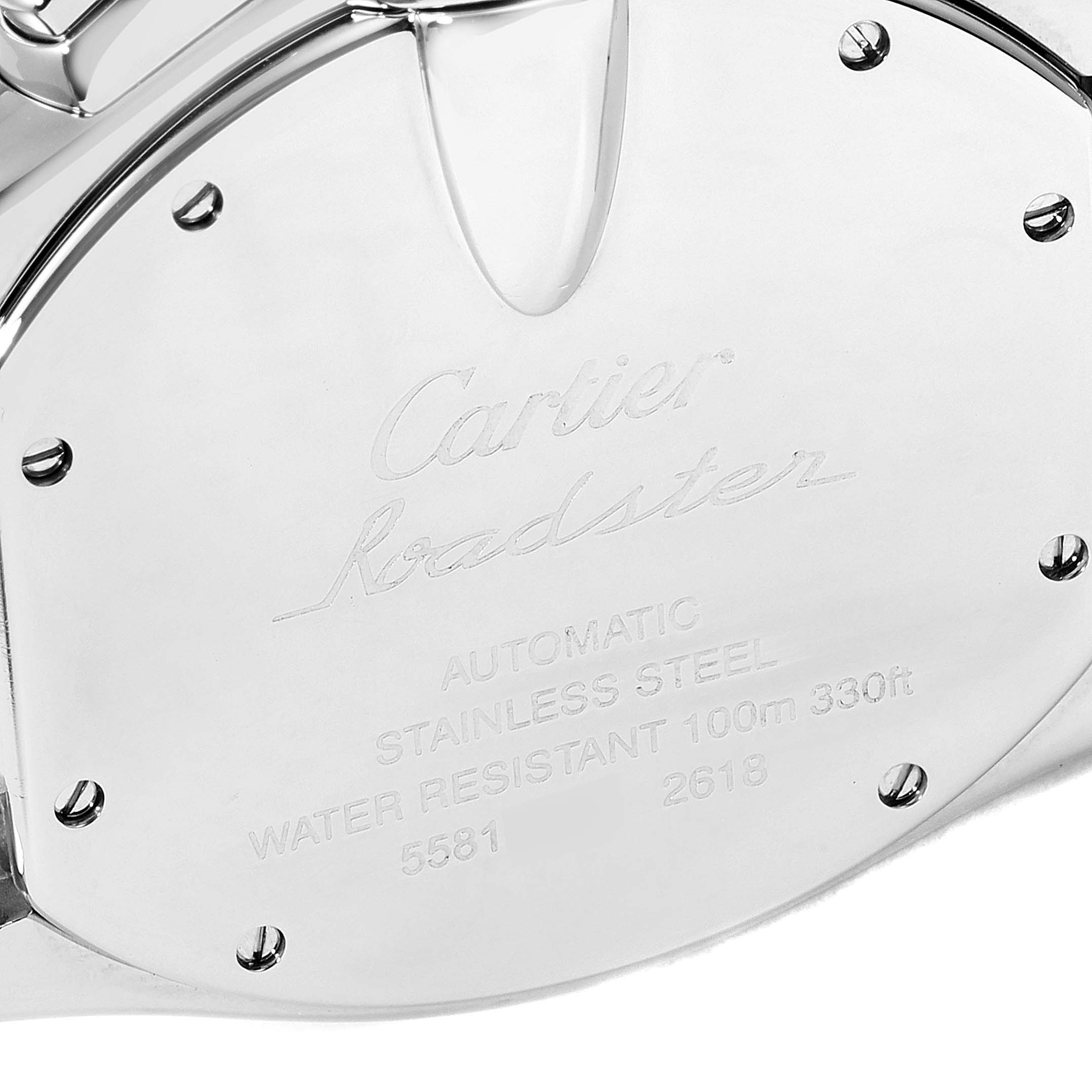 The image shows the back casing of the Cartier Roadster W62019X6 Men's Stainless Steel Silver Dial W62019X6 Men's Stainless Steel Silver Dial watch from a close-up angle, displaying engraved details and screws.