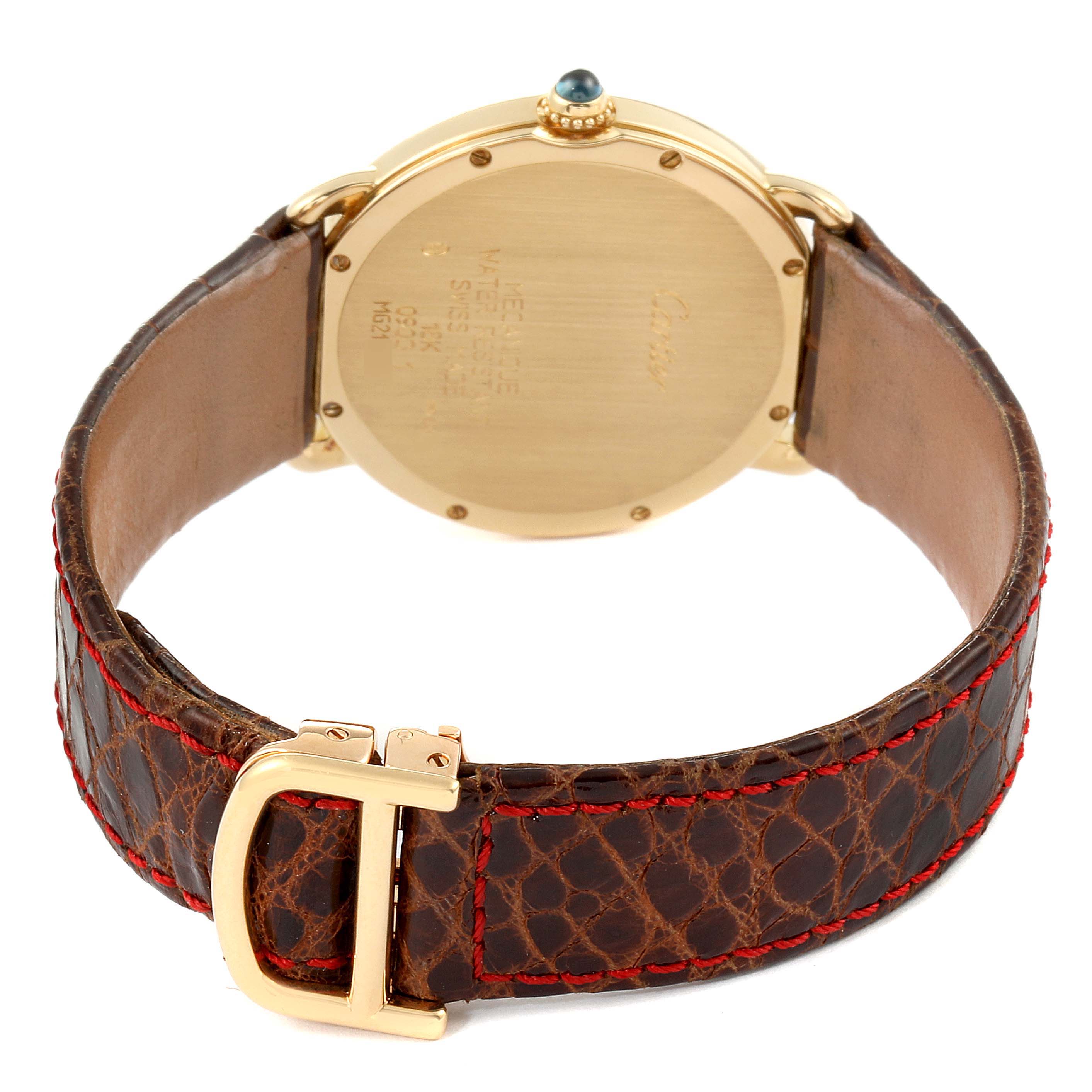 The image shows the back side of a Cartier Ronde 0900 Men's Yellow Gold Silver Dial 0900 Men's Yellow Gold Silver Dial watch, highlighting its case, crown, and leather strap with red stitching.