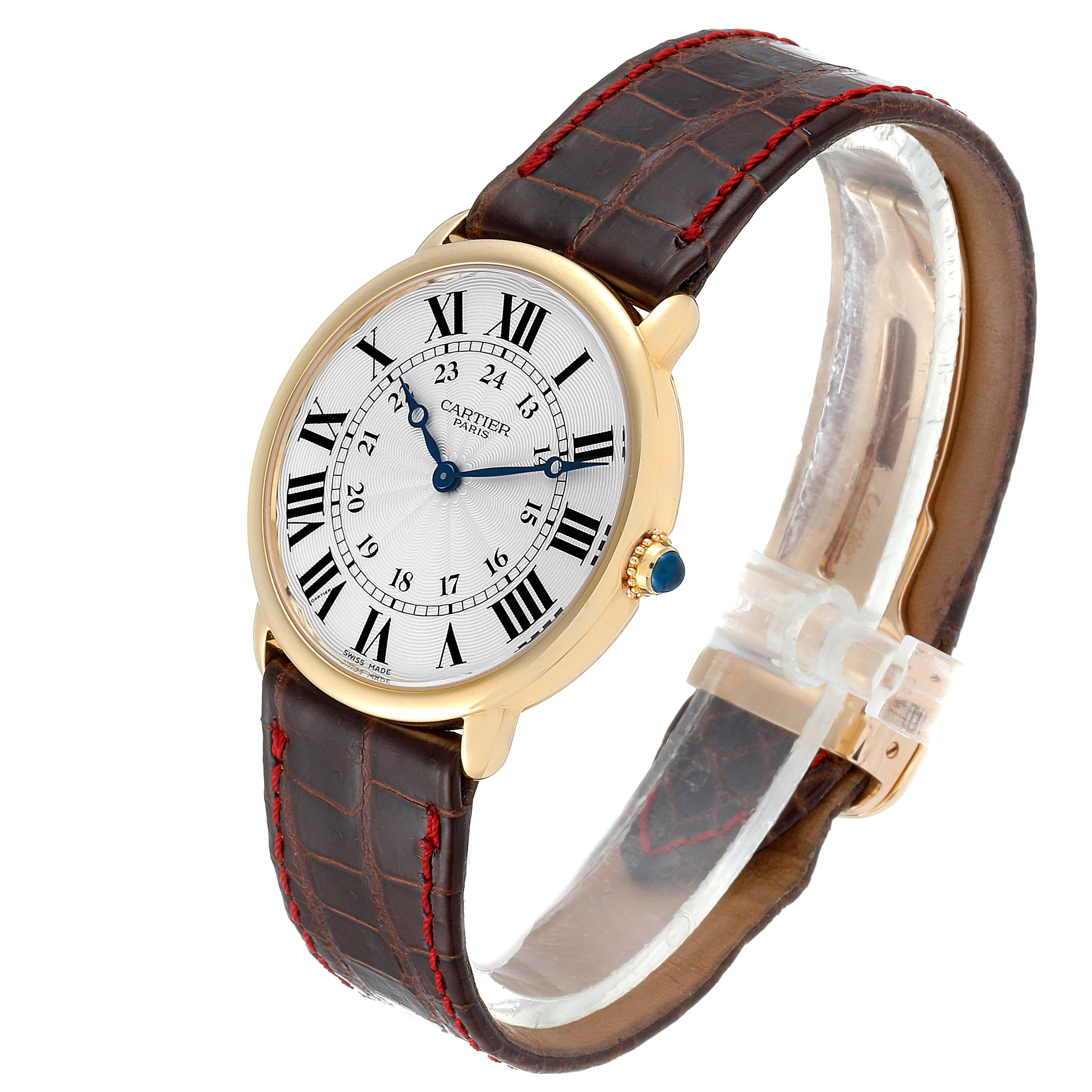 The Cartier Ronde 0900 Men's Yellow Gold Silver Dial 0900 Men's Yellow Gold Silver Dial watch is shown at a three-quarter view, highlighting the face, leather strap, and gold case with a blue cabochon crown.