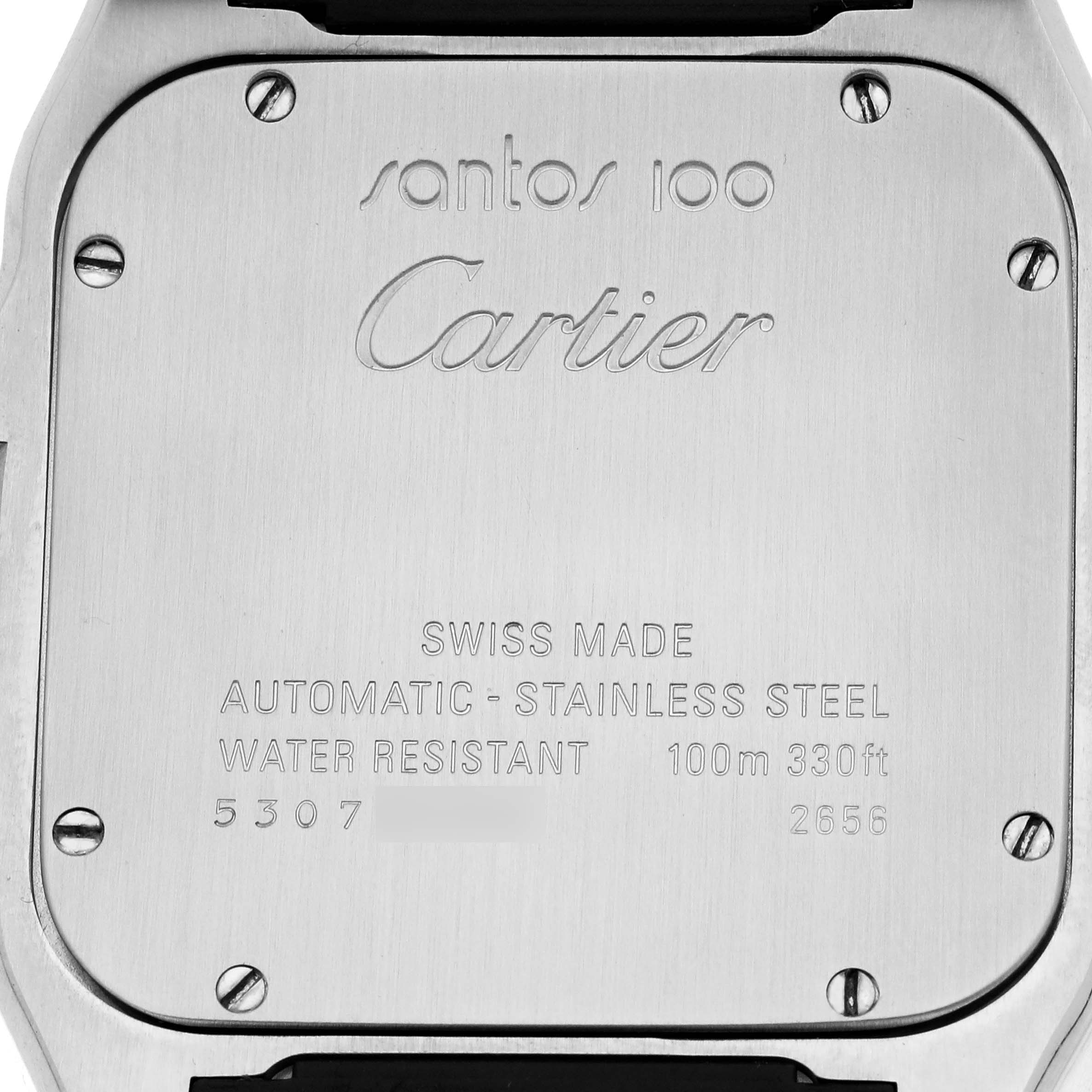 The image shows the back case of a Cartier Santos W20073X8 Men's Stainless Steel Silver Dial 100 watch with engraving details and screws visible.