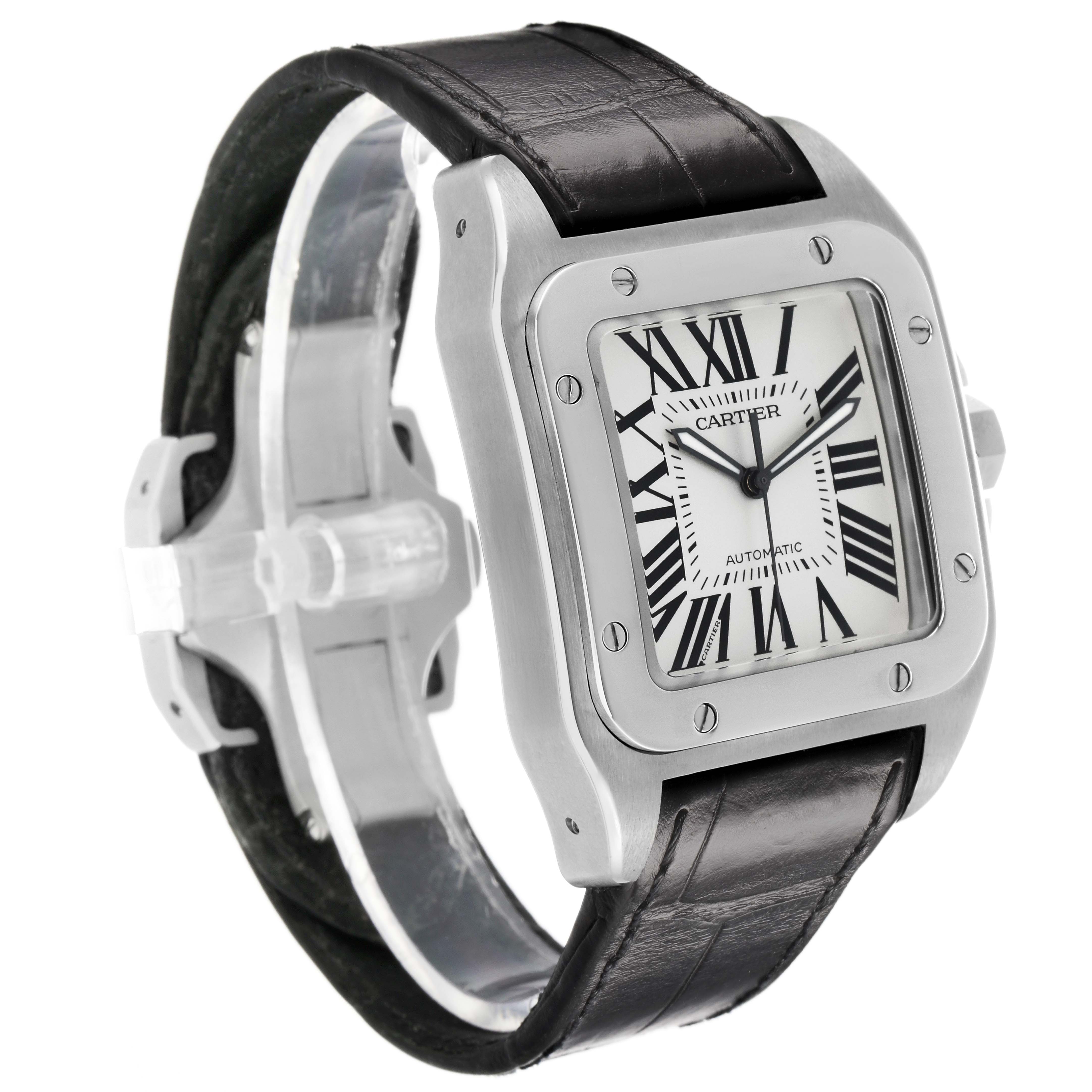The Cartier Santos W20073X8 Men's Stainless Steel Silver Dial watch is shown at a three-quarter view, featuring its square face, Roman numerals, and black leather strap.