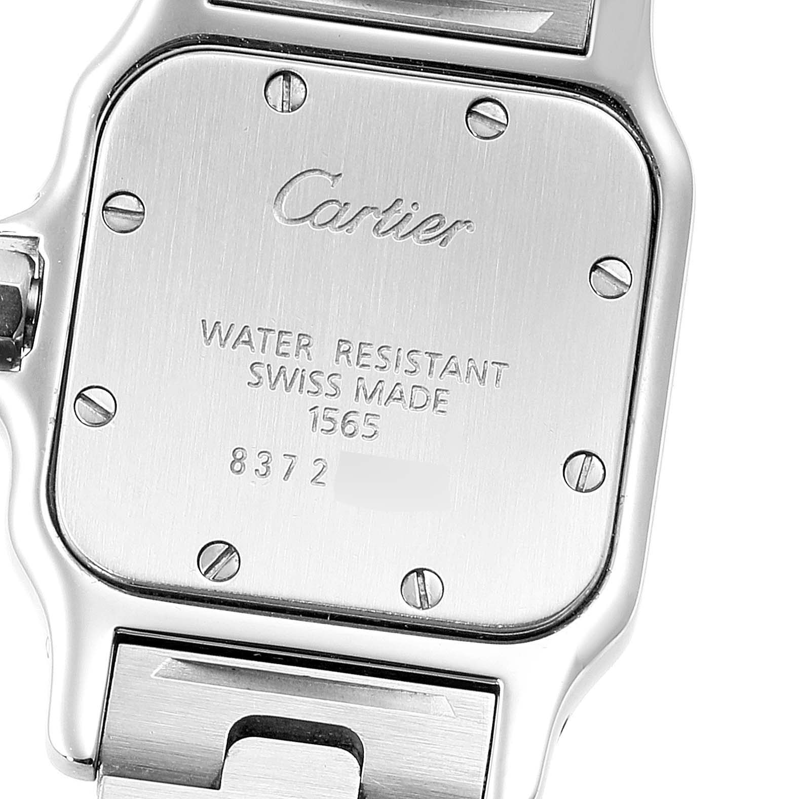 This image shows the back case of a Cartier Santos W20064D6 Women's Stainless Steel Blue Dial W20064D6 Women's Stainless Steel Blue Dial watch, featuring engravings and screws.