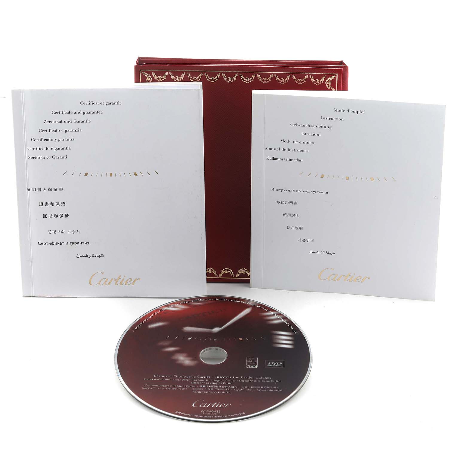 The image shows the Cartier Tank Anglaise WT100015 Women's White Gold Silver Dial model's packaging, including manuals, a DVD, and a red box.