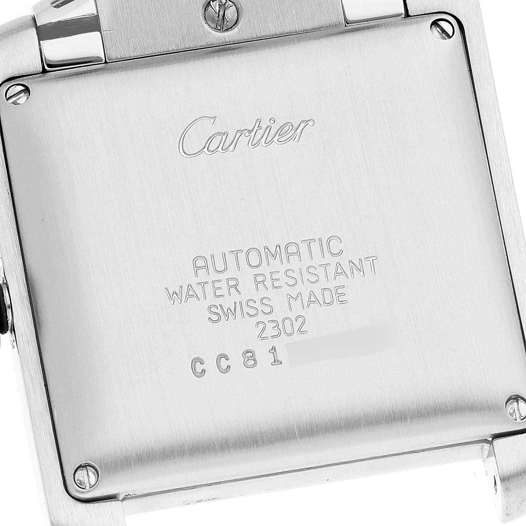 The image shows the back case of a Cartier Tank Francaise W51002Q3 Men's Stainless Steel Silver Dial W51002Q3 Men's Stainless Steel Silver Dial watch, displaying engraved details about its specifications.