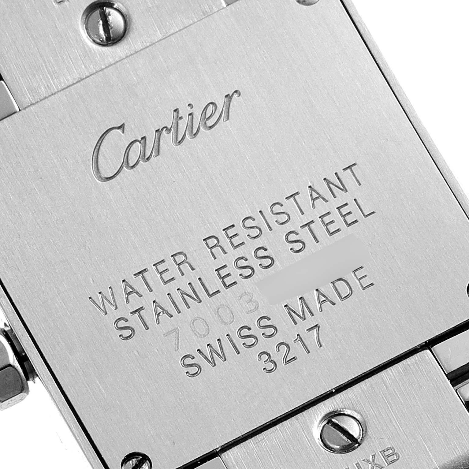 This image shows the back case of a Cartier Tank Francaise WE110006 Women's Stainless Steel Silver Dial WE110006 Women's Stainless Steel Silver Dial watch, highlighting the inscriptions and screws on the stainless steel plate.