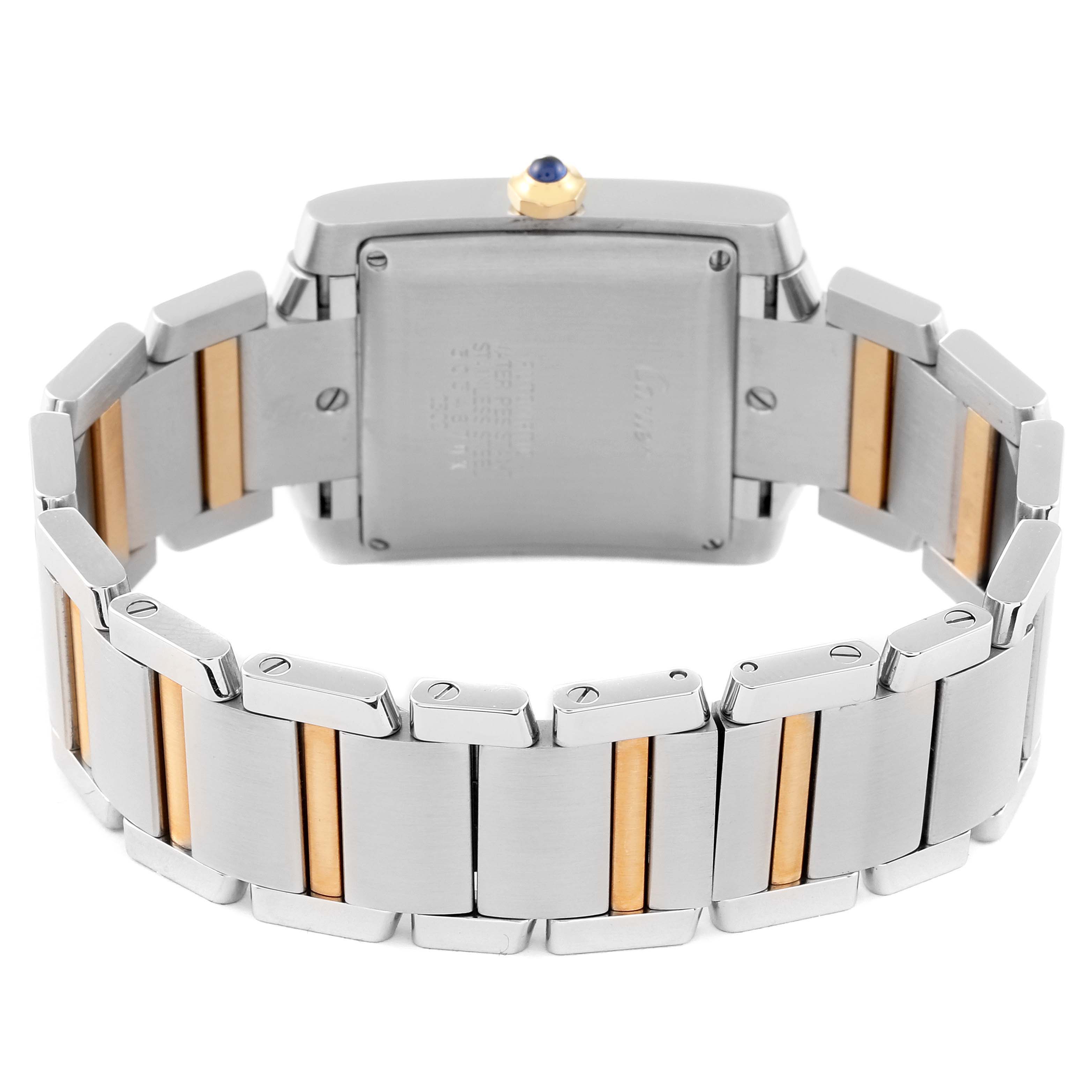 The image shows the back of a Cartier Tank Francaise W51005Q4 Men's Steel and Gold (two tone) Silver Dial W51005Q4 Men's Steel and Gold (two tone) Silver Dial watch, highlighting the dual-tone bracelet and case back.