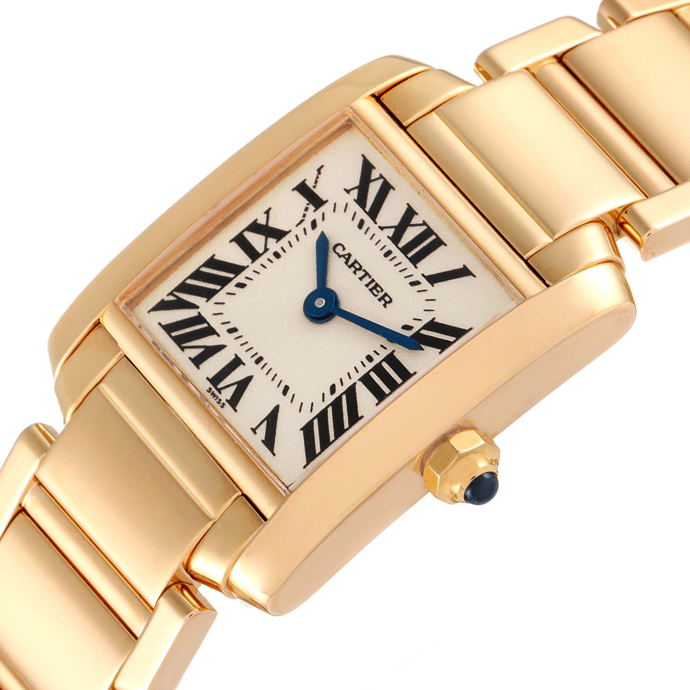The Cartier Tank Francaise W50002N2 Women's Yellow Gold Silver Dial W50002N2 Women's Yellow Gold Silver Dial watch is shown at an angle highlighting its gold case, Roman numeral dial, and blue hands.