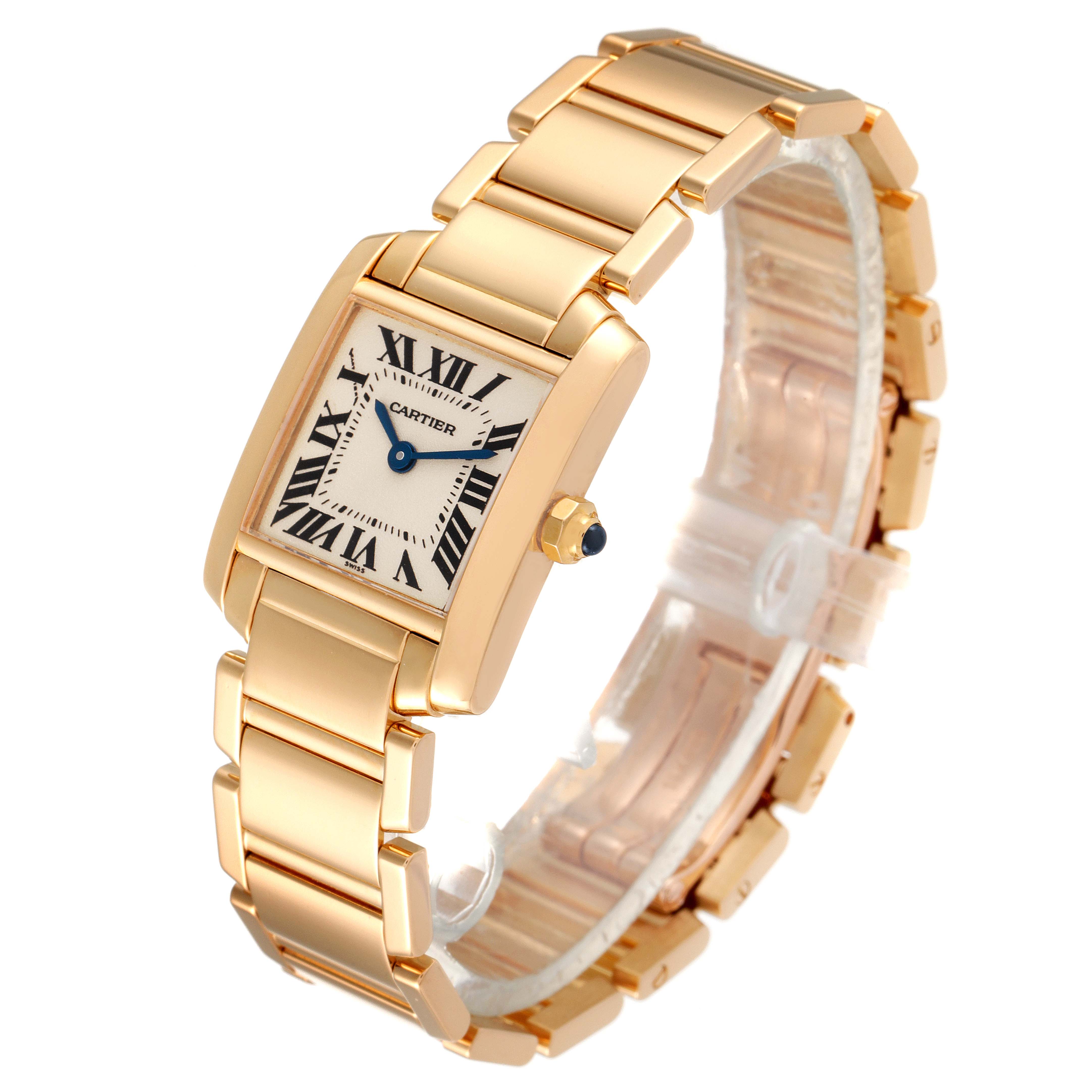 This Cartier Tank Française watch is shown at an angled view, detailing its gold bracelet, rectangular dial, and blue hands.