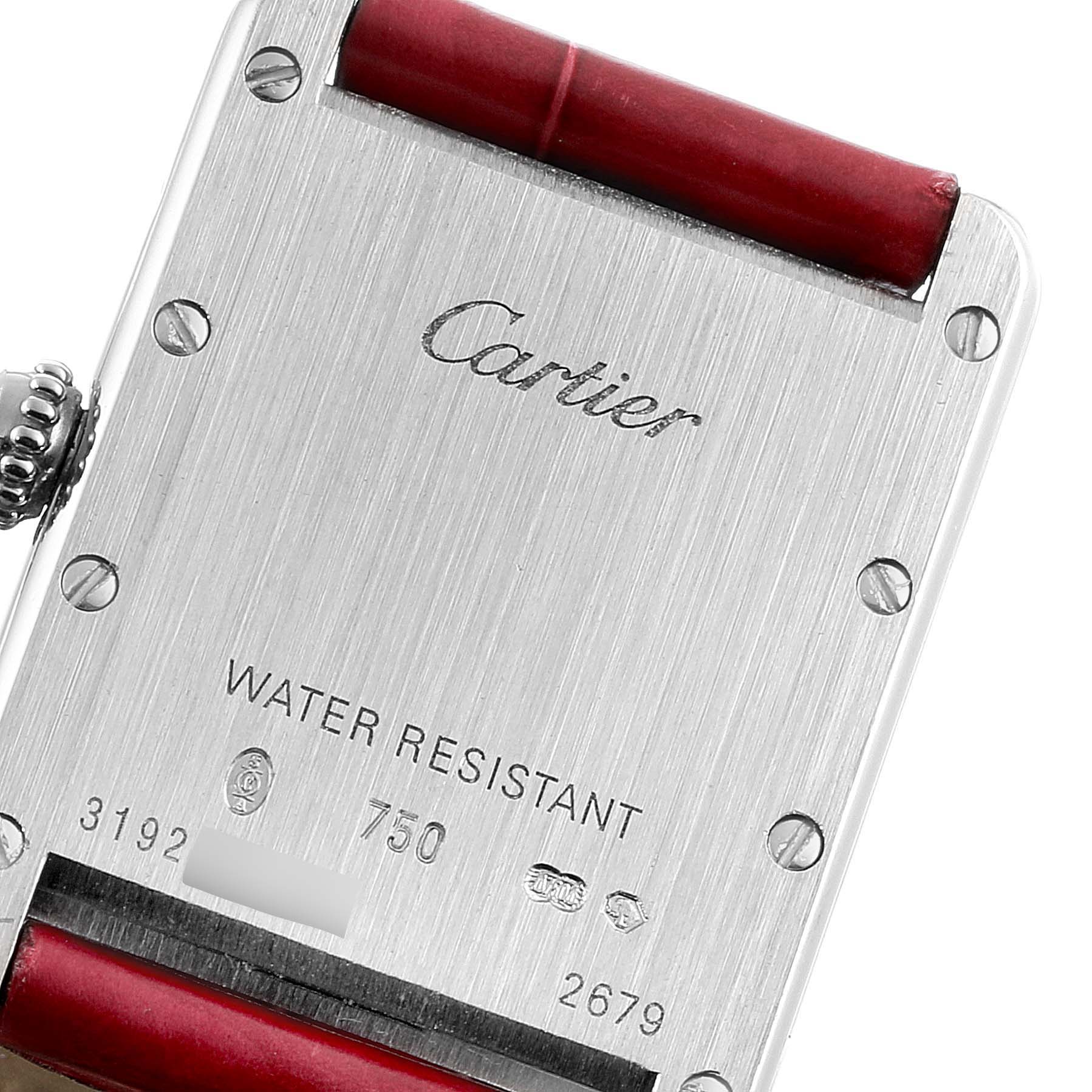 The image shows the back case and part of the red strap of the Cartier Tank Louis W1541056 Women's White Gold Silver Dial W1541056 Women's White Gold Silver Dial watch.