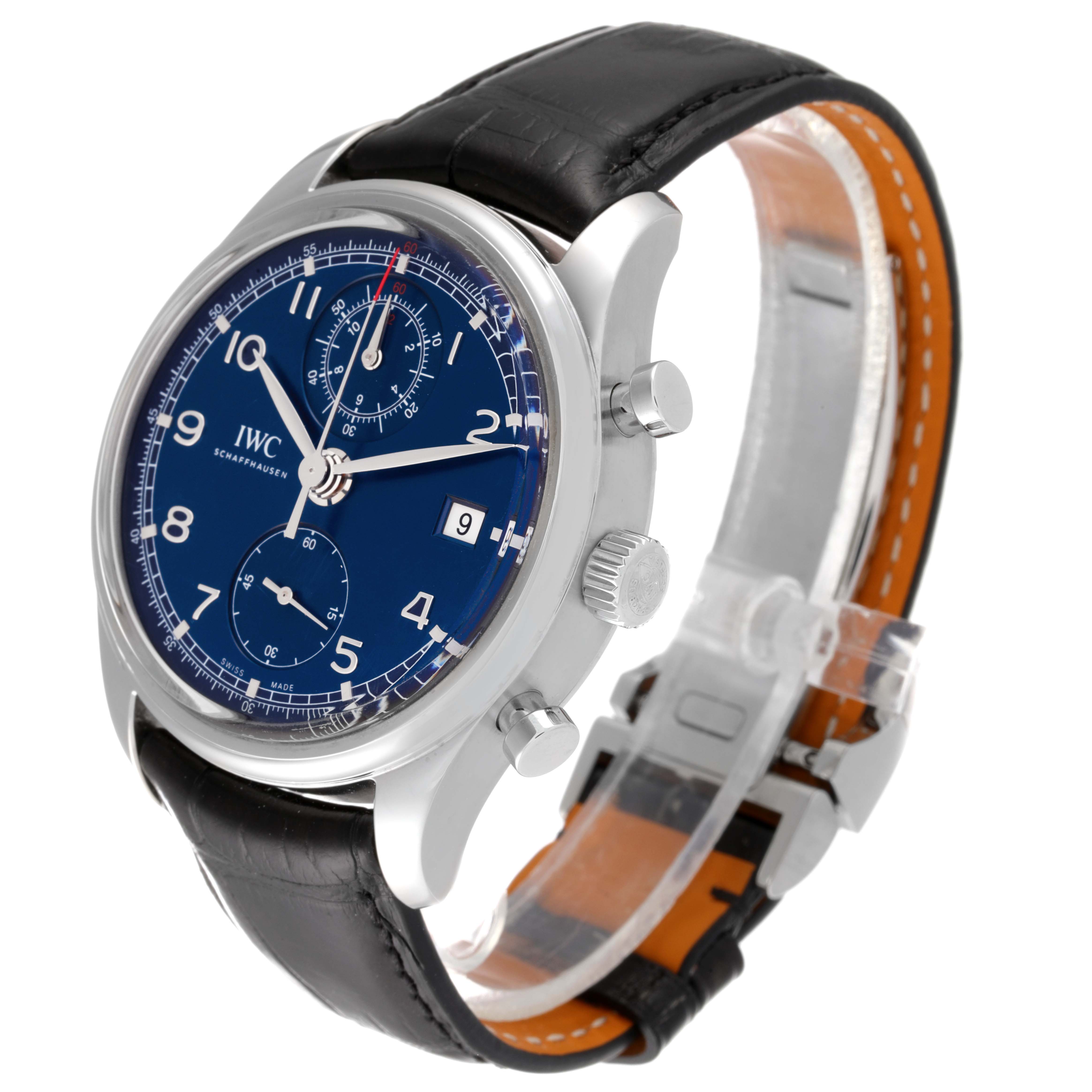 This is an angled view of the IWC Portuguese IW390406 Men's Stainless Steel Blue Dial IW390406 Men's Stainless Steel Blue Dial model, showing the blue dial, crown, pushers, and black leather strap.