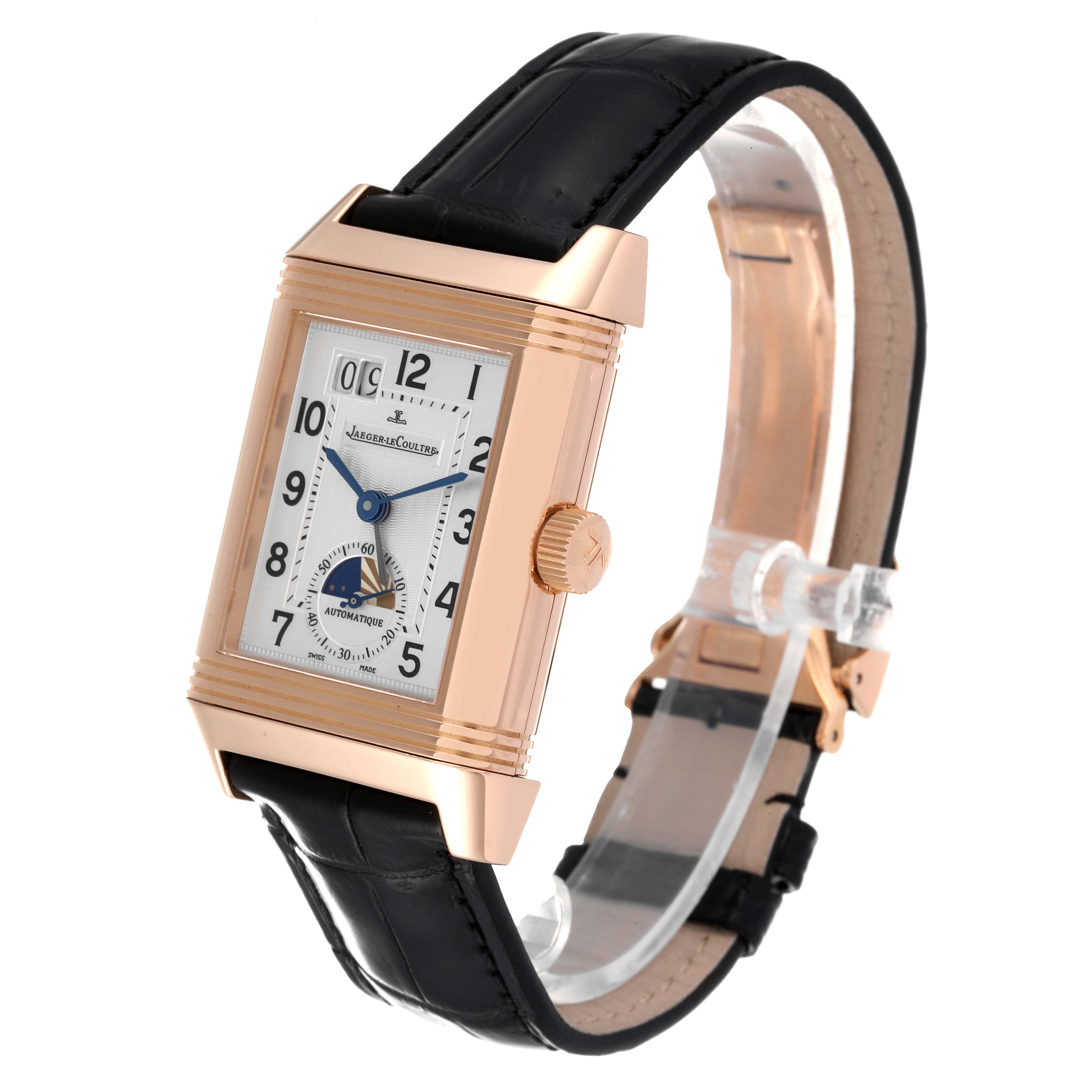 The image shows a Jaeger-LeCoultre Reverso watch at a three-quarter angle, displaying the face, crown, and black leather strap.