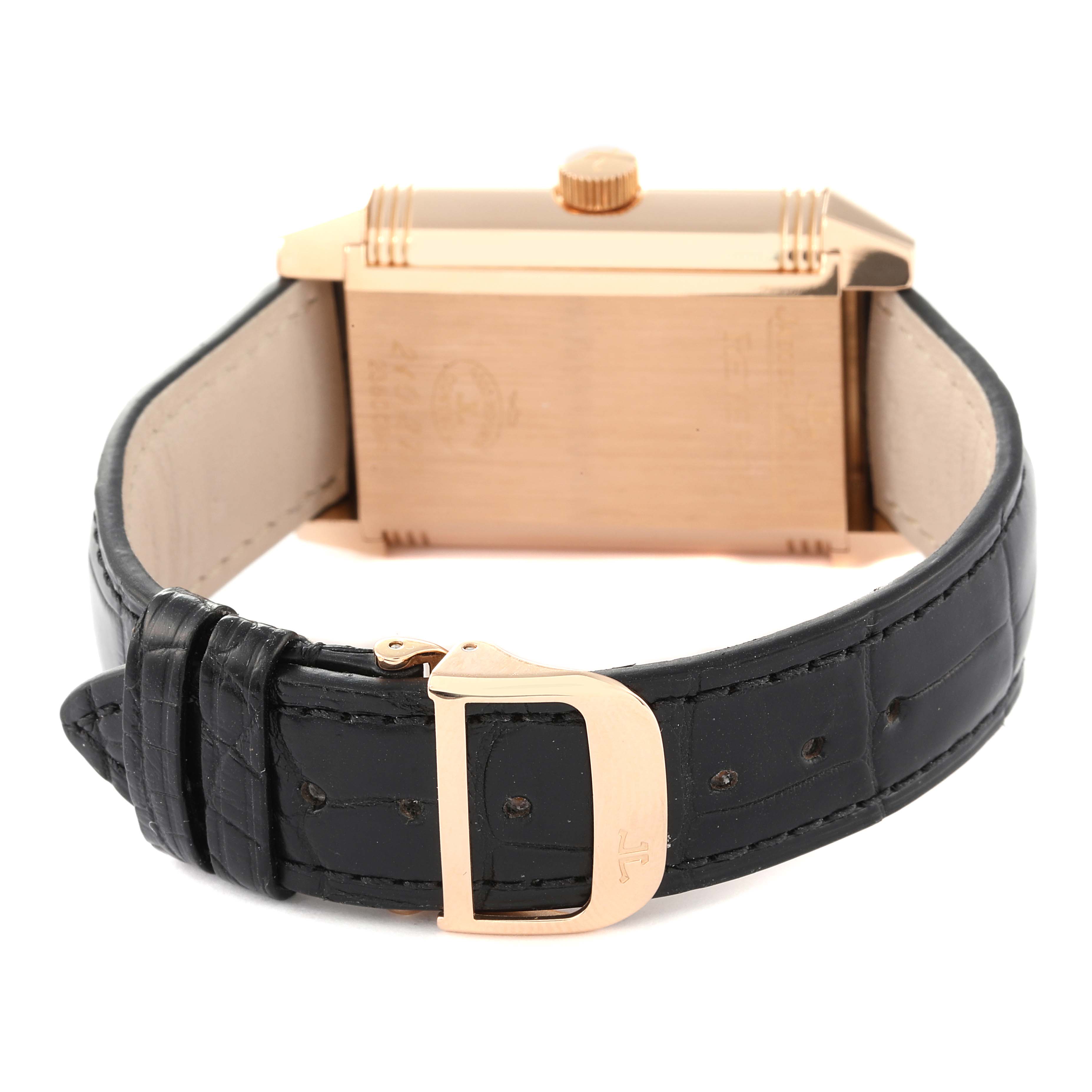 This image shows the back view of a Jaeger LeCoultre Reverso Q3032420 Men
s Rose Gold Silver Dial Q3032420 Men
s Rose Gold Silver Dial watch, featuring part of its case, crown, and leather strap with buckle.