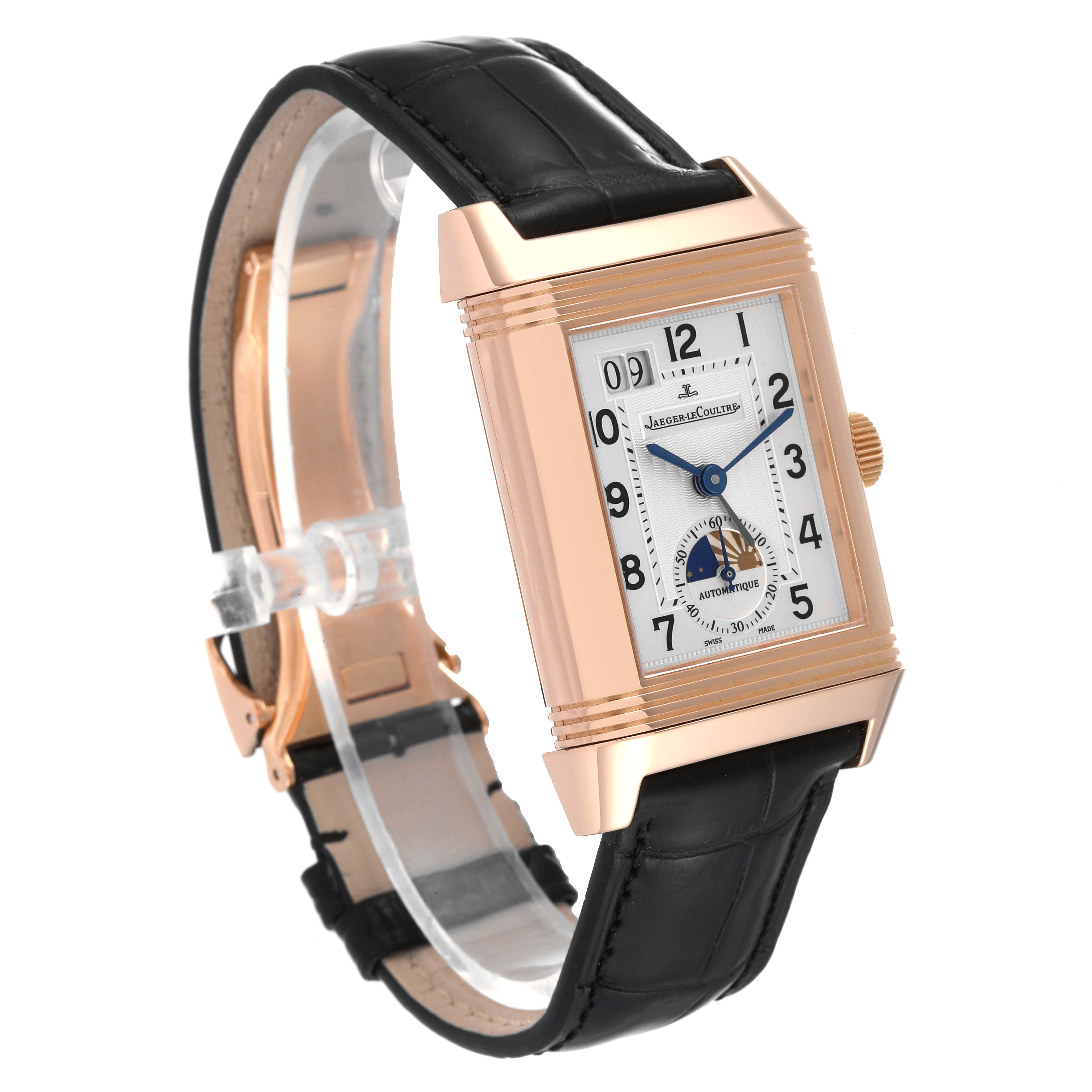 The image shows a Jaeger-LeCoultre Reverso watch from a three-quarter angle, highlighting the face, case, and black leather strap.