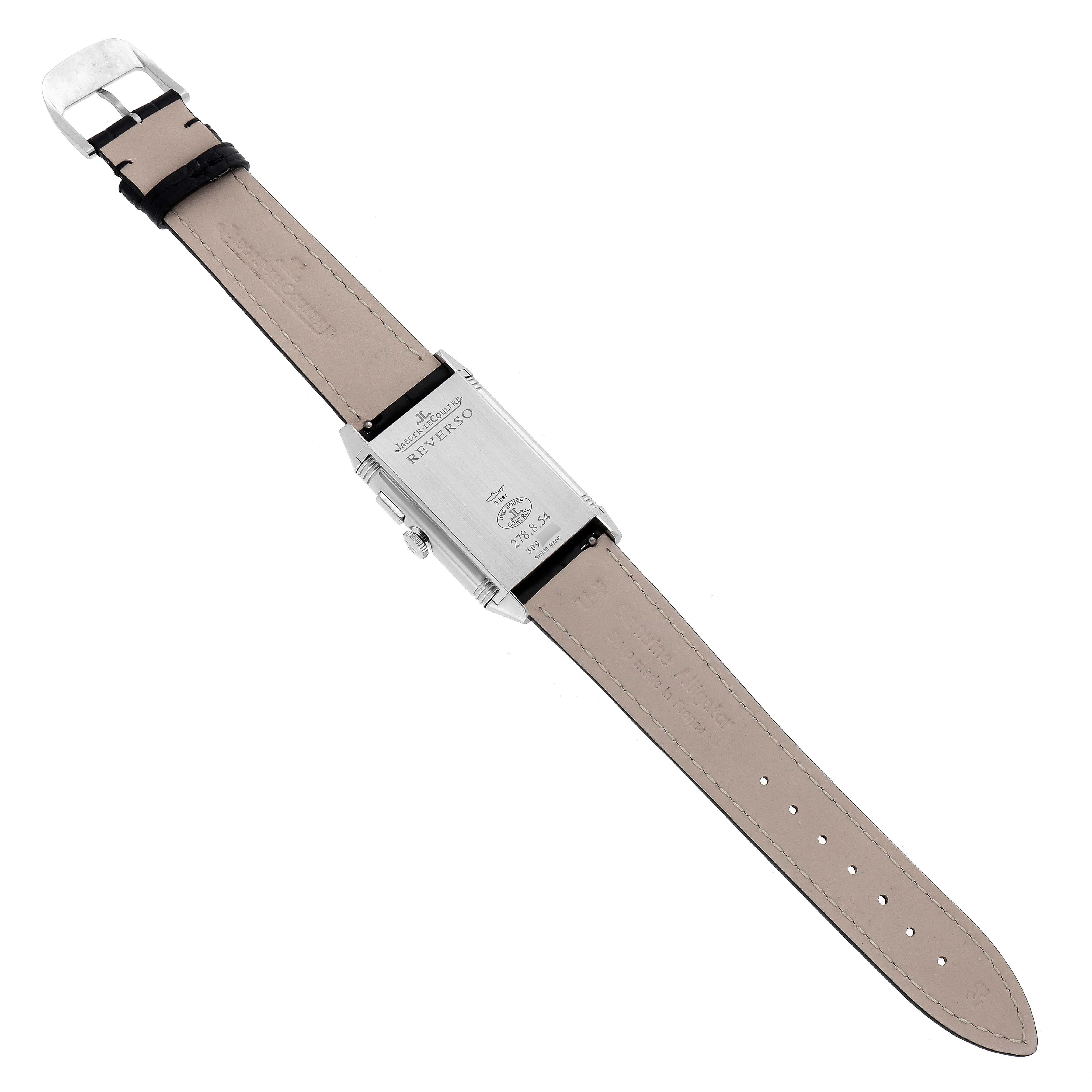 The Jaeger-LeCoultre Reverso watch is shown from the back, focusing on the strap and case back details.