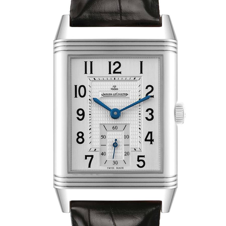 The Jaeger-LeCoultre Reverso watch is shown from a frontal angle, featuring its rectangular case, watch face, dial, and crown.