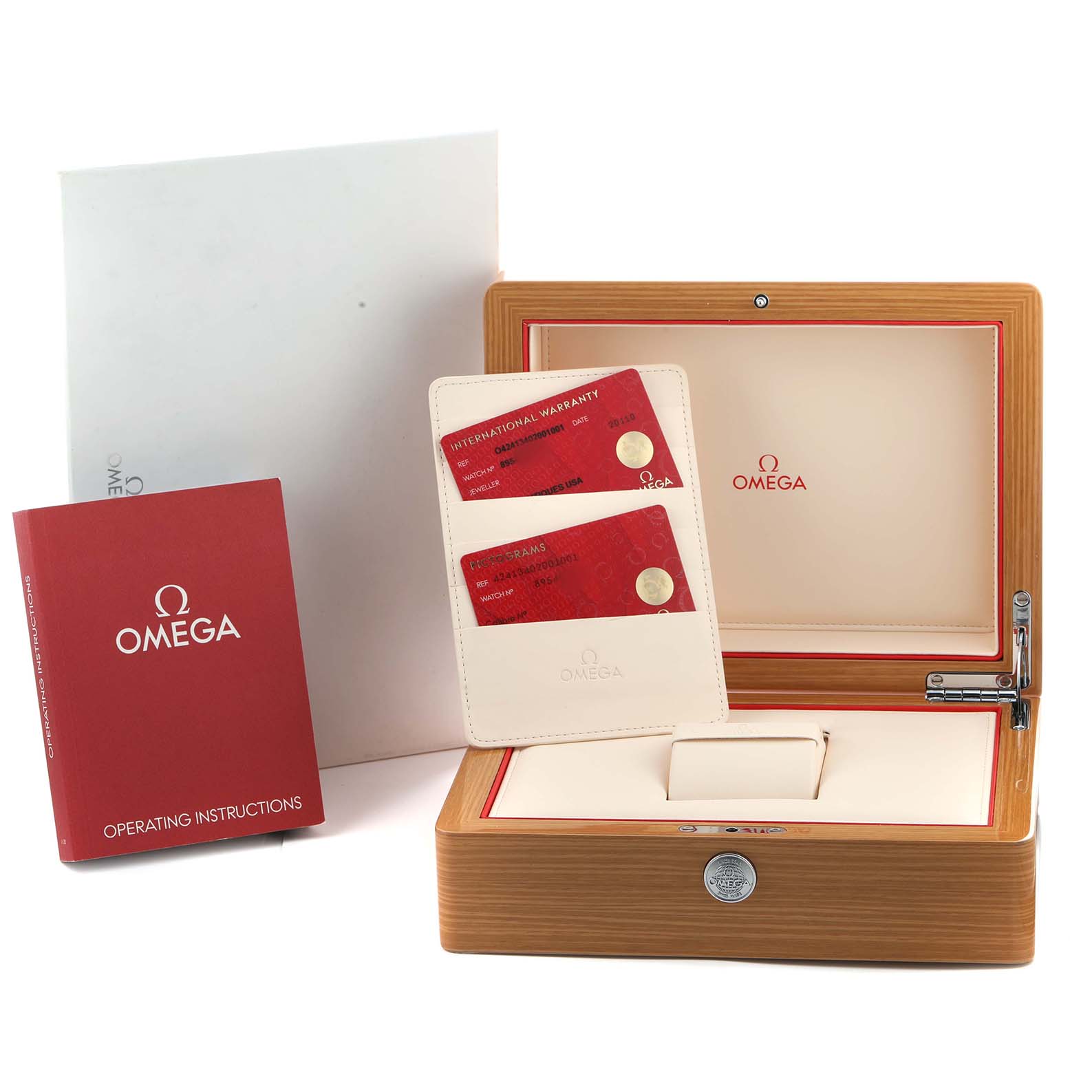 The image shows the Omega De Ville 424.13.40.20.01.001 Men's Stainless Steel Black Dial packaging with the box, warranty cards, and operating instructions.