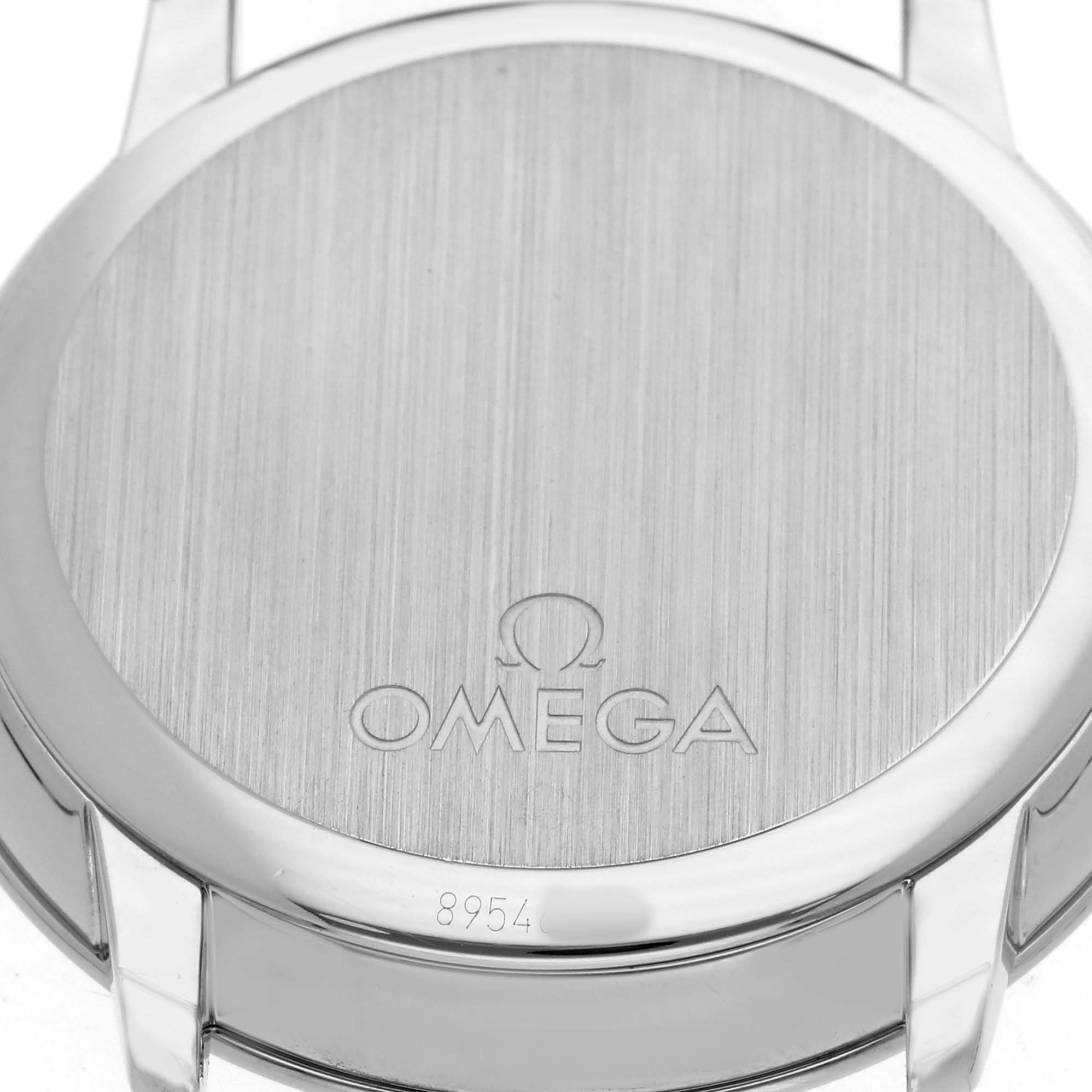 The image shows the case back of an Omega De Ville 424.13.40.20.01.001 Men's Stainless Steel Black Dial watch at a straight-on angle, featuring the Omega logo and a serial number.