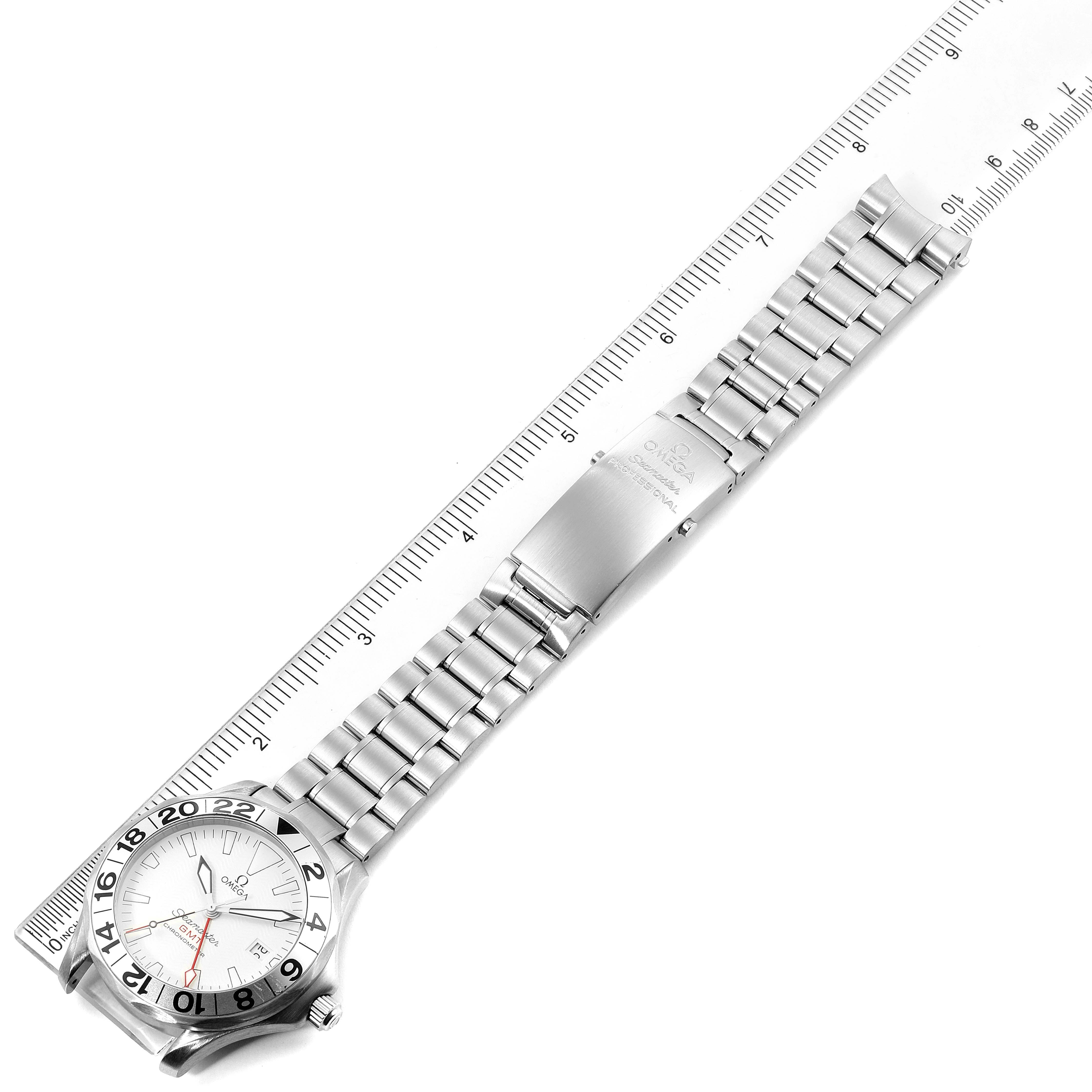 The image shows an Omega Seamaster 2538.20.00 Men's Stainless Steel White Dial 2538.20.00 Men's Stainless Steel White Dial watch laid flat with a ruler for scale, highlighting the face, bezel, bracelet, and clasp.