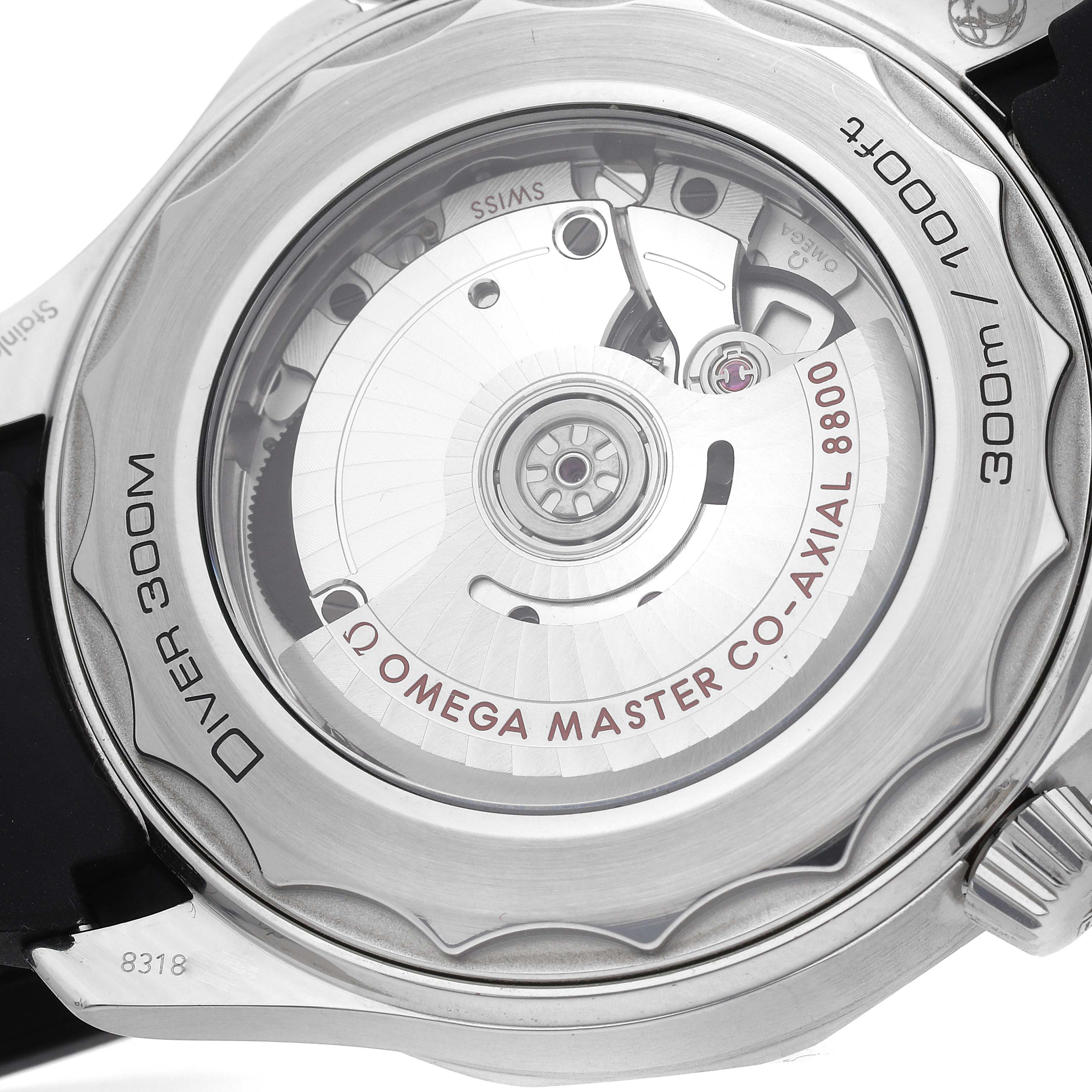 The image shows the back view of an Omega Seamaster 210.32.42.20.01.001 Men's Stainless Steel Black Dial, highlighting its co-axial movement through a transparent case back.