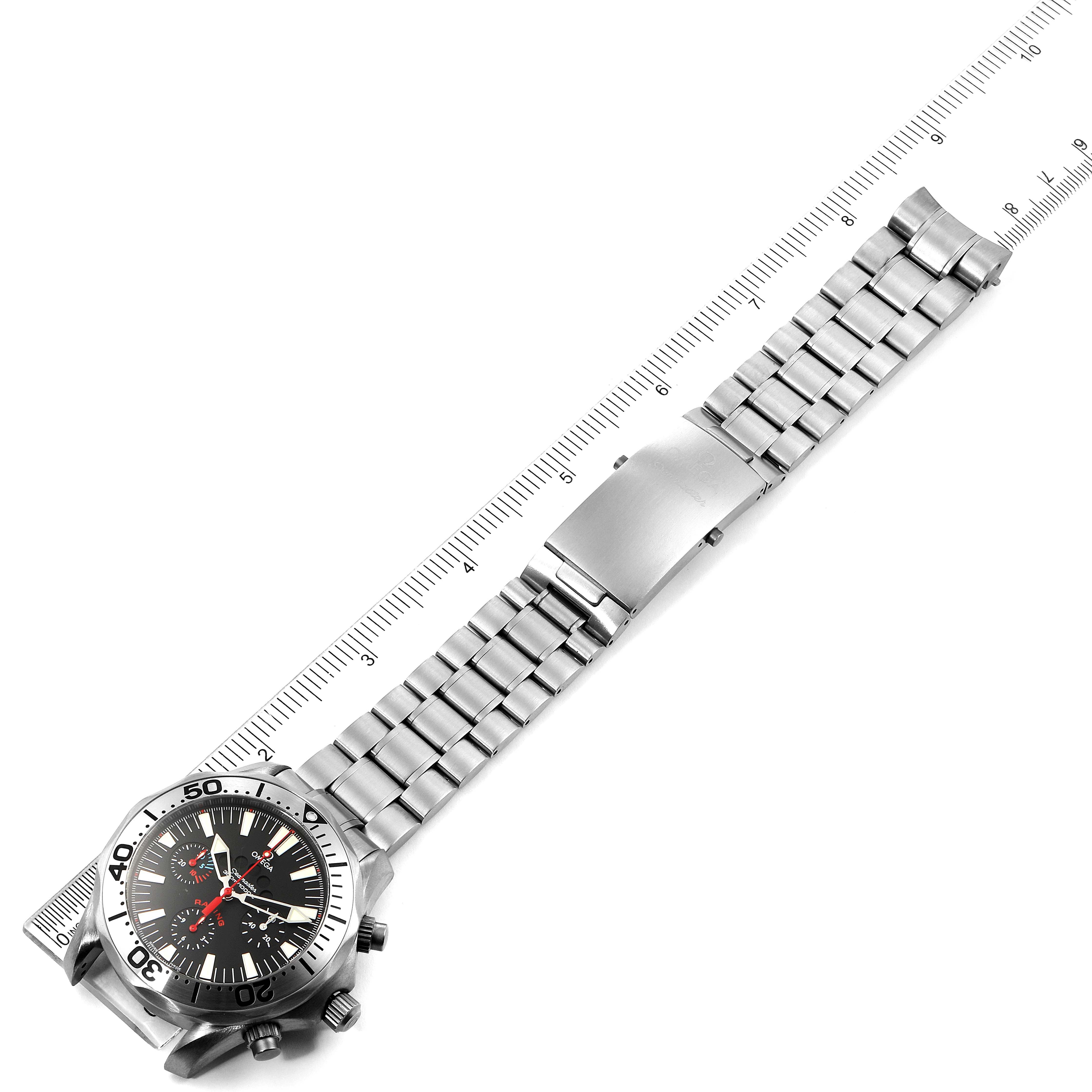 The image shows a full view of an Omega Seamaster 2269.52.00 Men's Titanium Black Dial 2269.52.00 Men's Titanium Black Dial watch laid flat next to a ruler, displaying its metal bracelet and case.