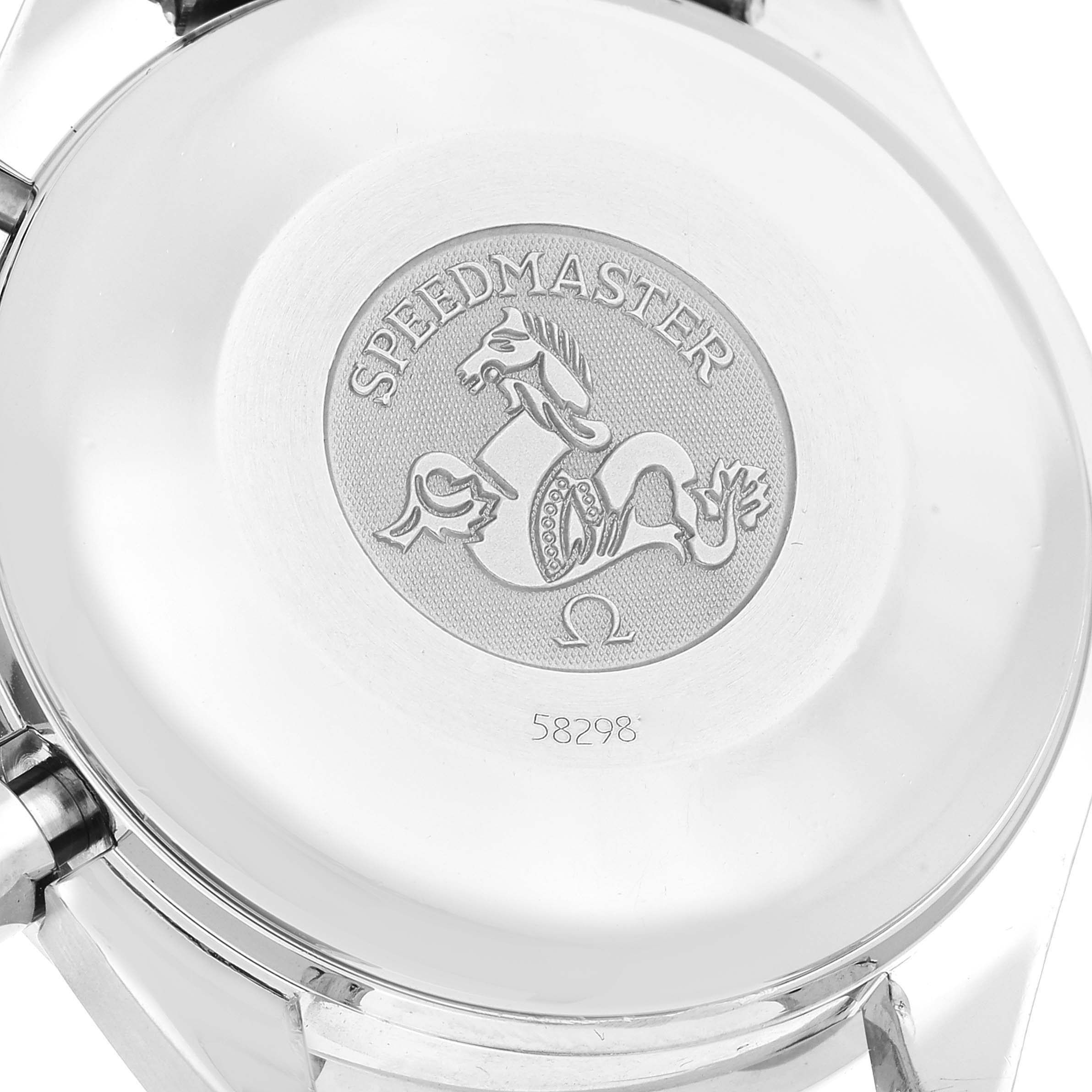 The image shows the case back of an Omega Speedmaster 3523.30.00 Men's Stainless Steel Silver Dial 3523.30.00 Men's Stainless Steel Silver Dial watch with its emblem and engraved serial number.