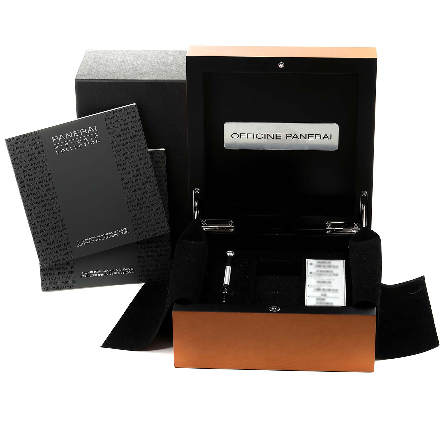 This image shows the packaging, manual, and accessories for a Panerai Luminor PAM00510 Men
s Stainless Steel Black Dial PAM00510 Men
s Stainless Steel Black Dial watch, featuring an open box and booklet.